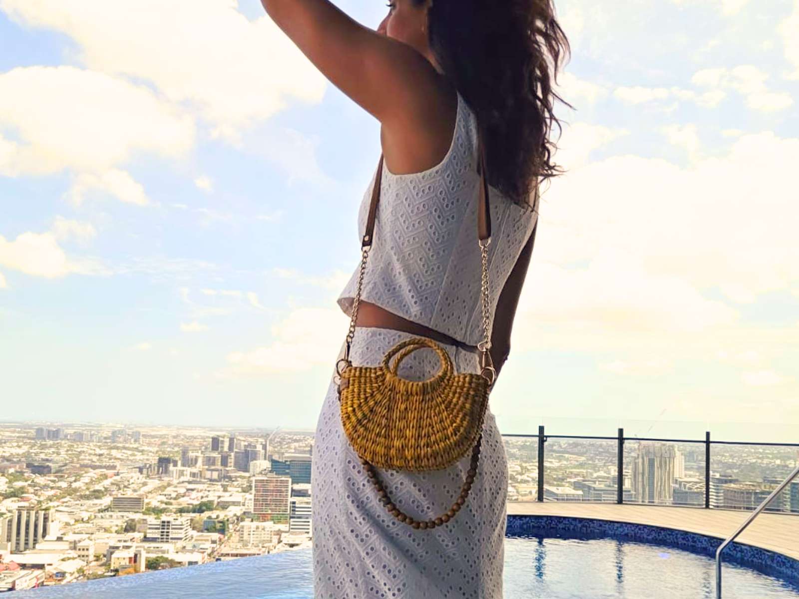 Model wearing the Fiesta Mini junco crossbody bag in yellow