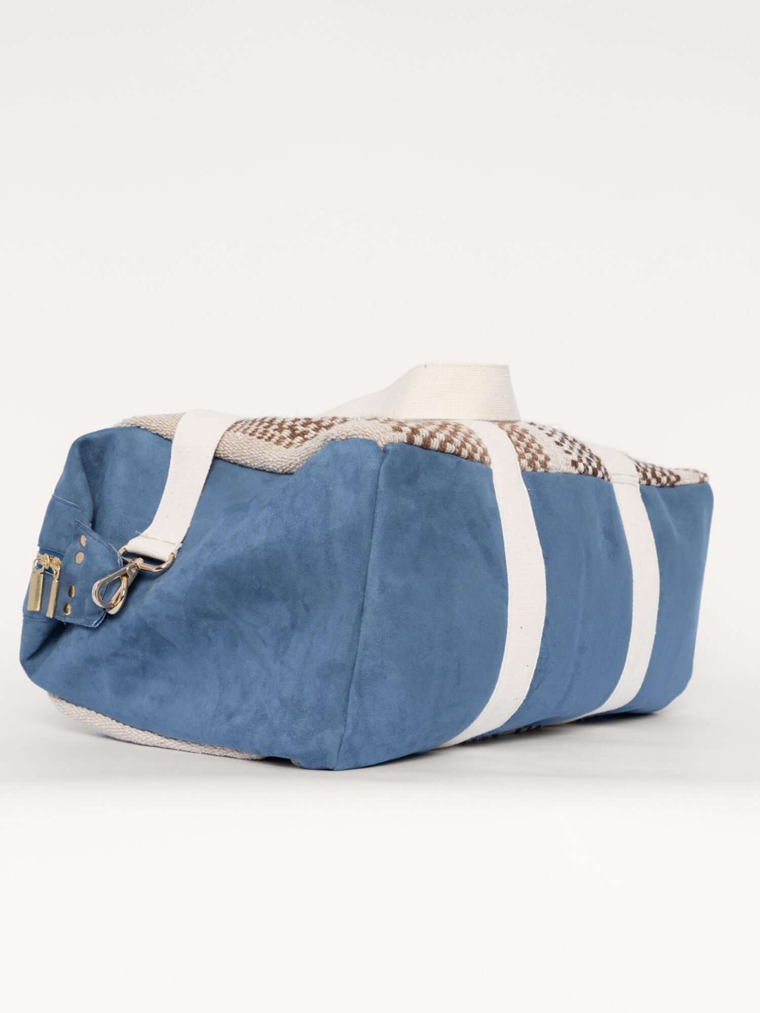Bottom view of wool and suede weekender bag – structured base with reinforced corners and artisan stitching