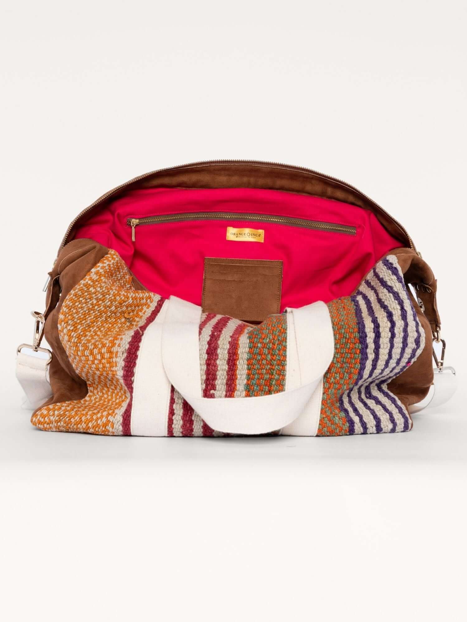 Interior of weekender bag with fuchsia lining – spacious handmade travel duffle with elastic and zip pockets