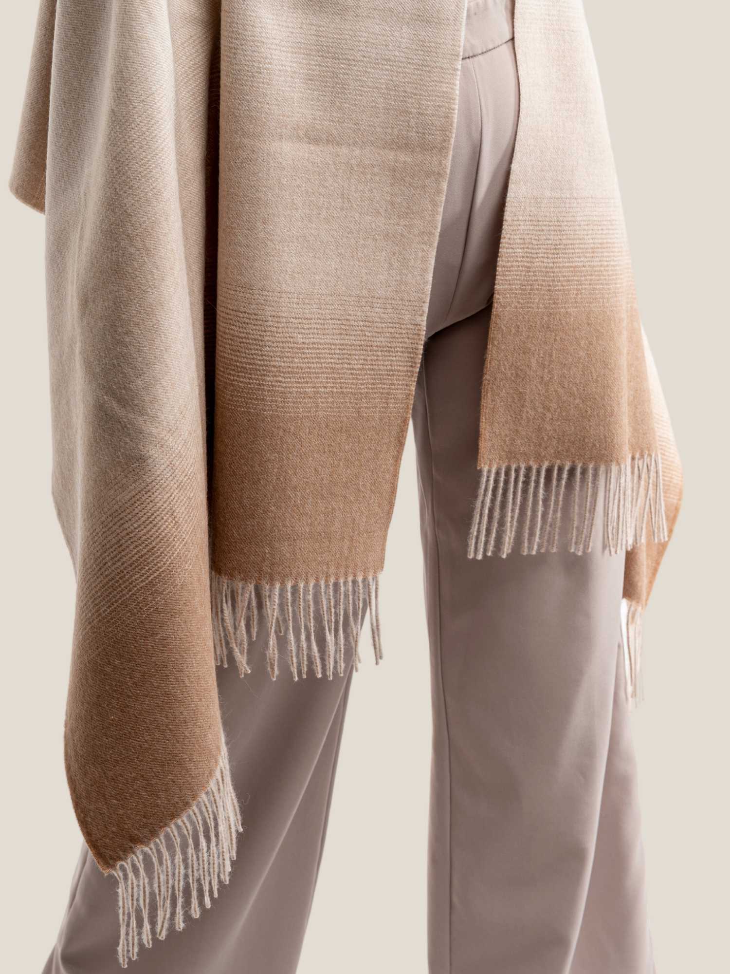Close-up of beige and camel ombre baby alpaca shawl – undyed natural fibre and fringed ends | Orange Inca