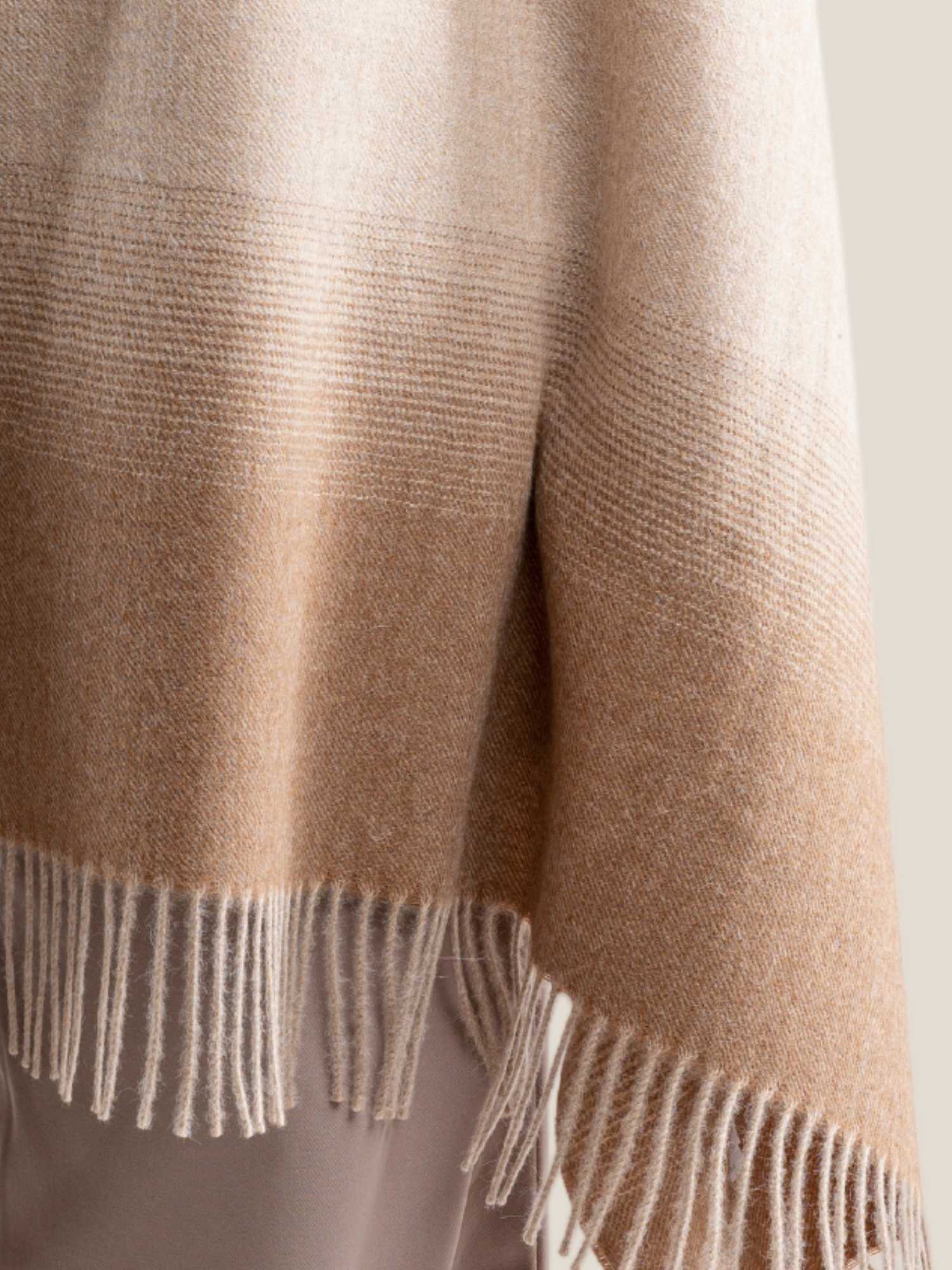 Beige and camel ombre baby alpaca shawl worn – undyed gradient close-up | Orange Inca
