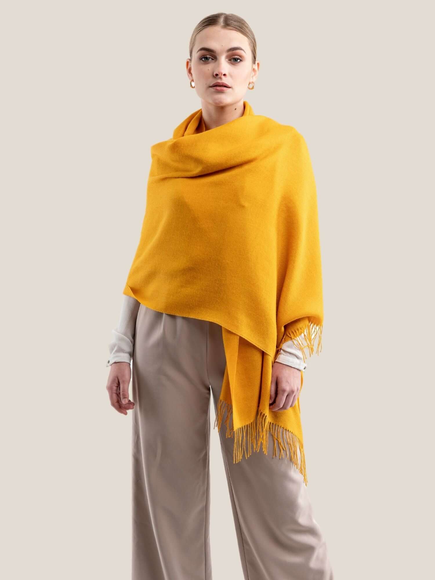 Yellow alpaca wool shawl draped to show full length and drape