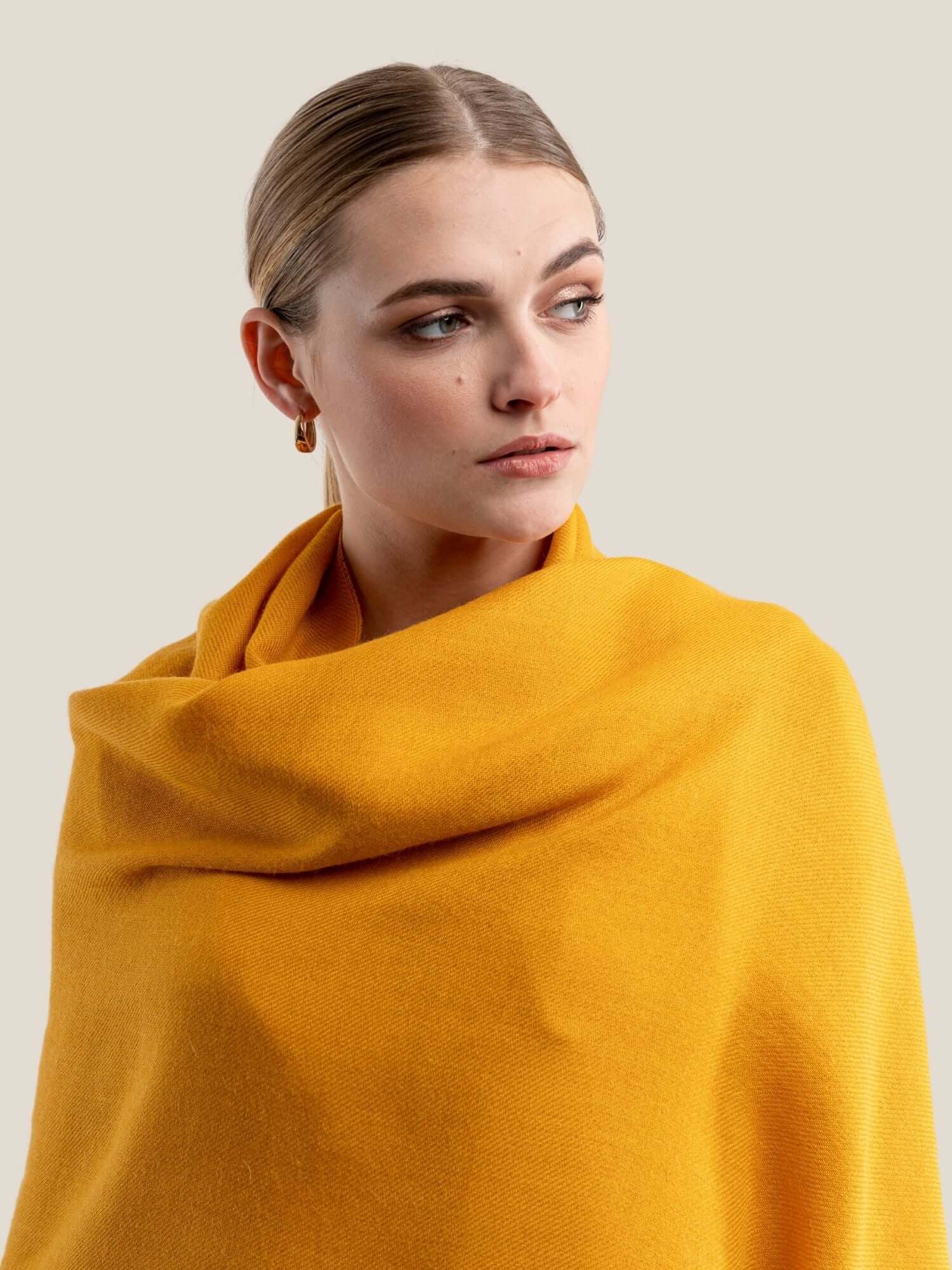 Yellow Luxury alpaca shawl styled as elegant evening wrap for formal occasions
