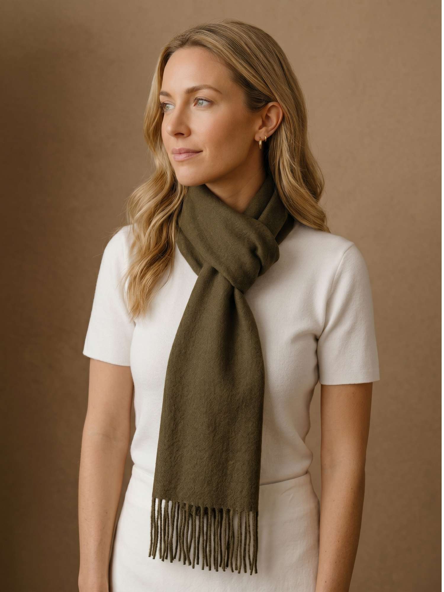 Olive green baby alpaca scarf worn over the shoulders — naturally dyed, handmade in Peru | Orange Inca