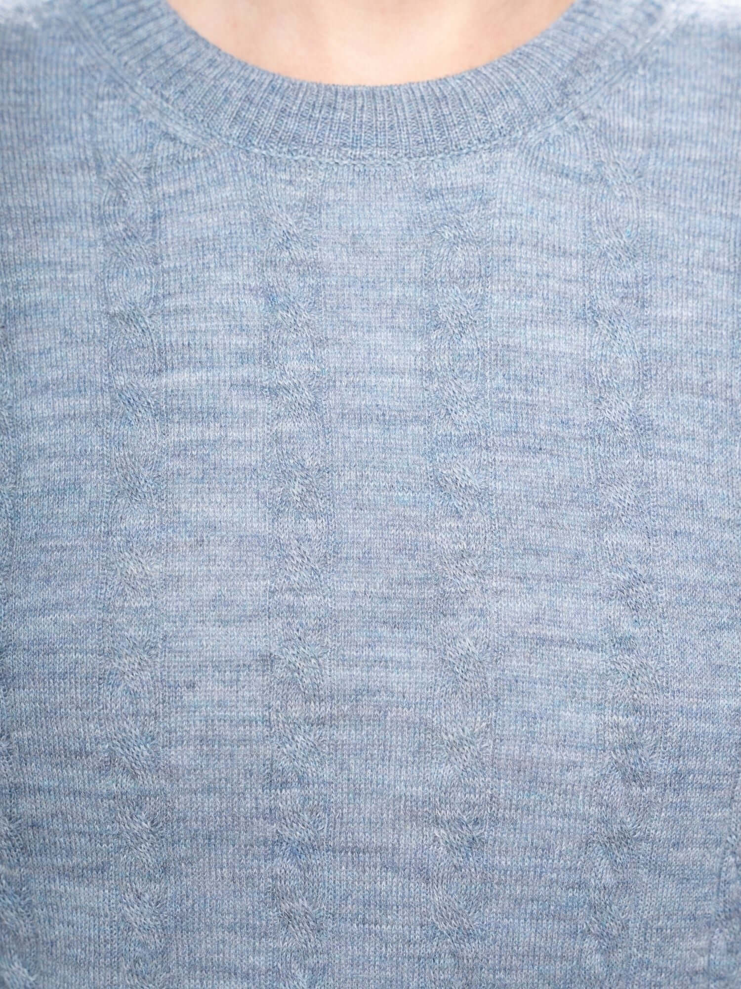 Close-up of cable knit pattern on blue grey alpaca jumper made from baby alpaca yarn