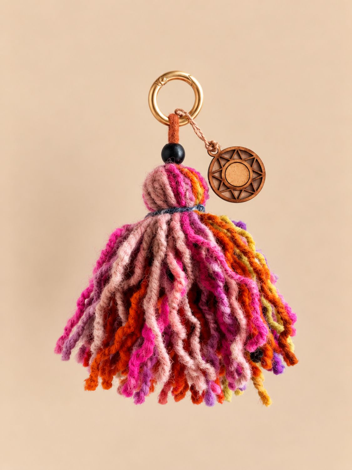 Chunky wool bag charm and keychain in pink, orange and magenta with a light gold ring and wooden sun charm | Tasselita by Orange Inca
