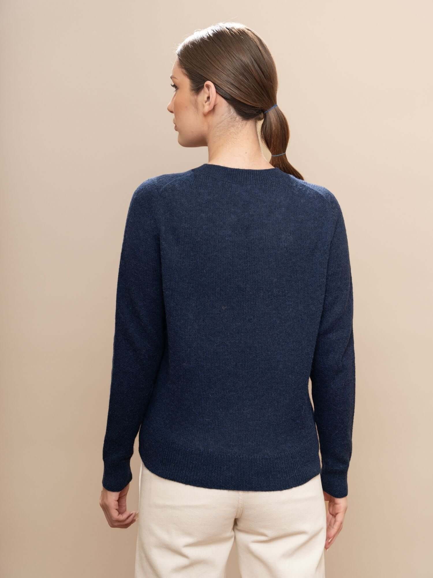 Back view of navy blue sweater in ultra-soft baby alpaca wool