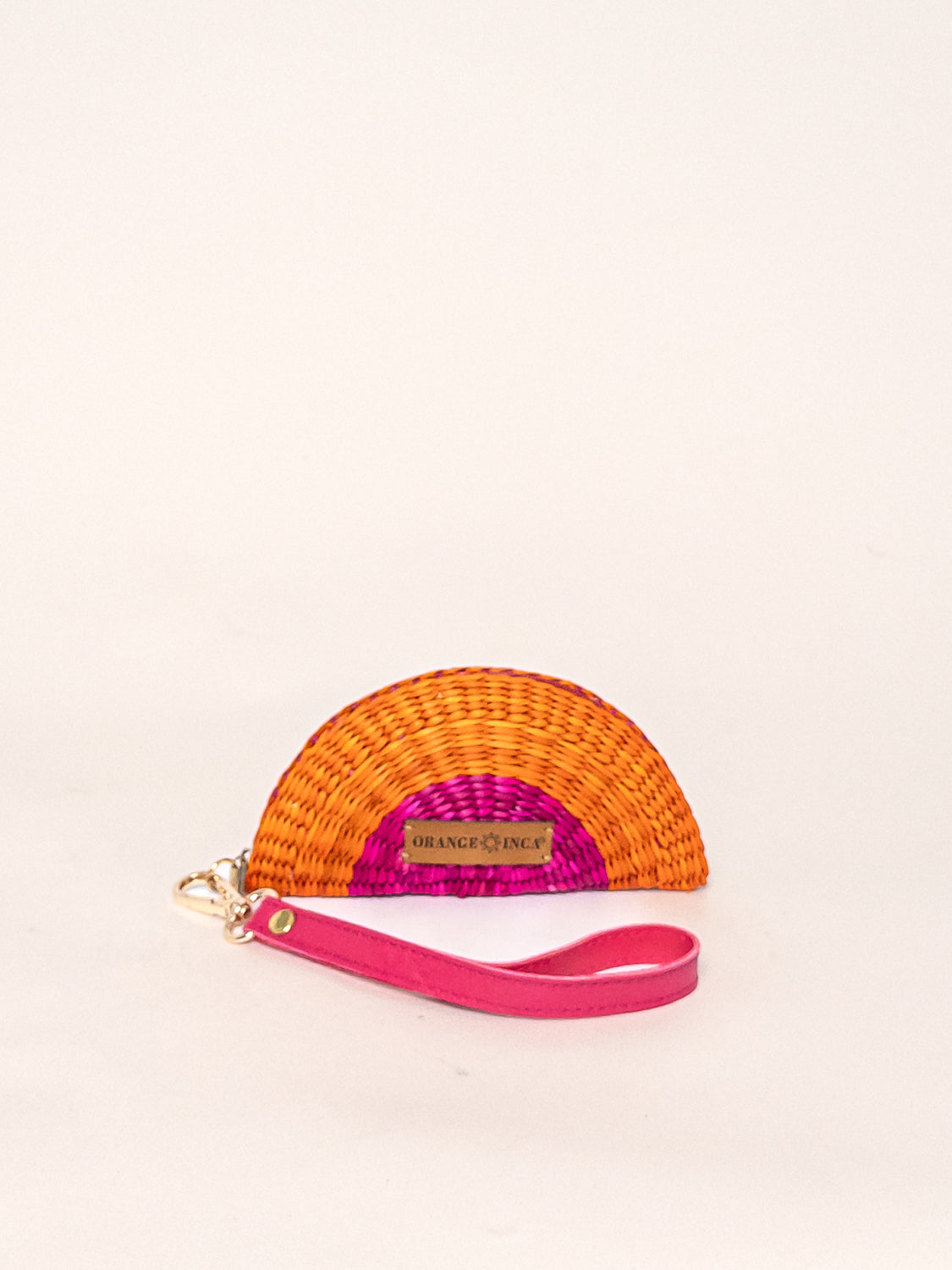 Playa Coin Purse – Faux Leather Strap, handwoven coin purse in orange and pink fuchsia junco reed with a detachable pink faux leather strap.