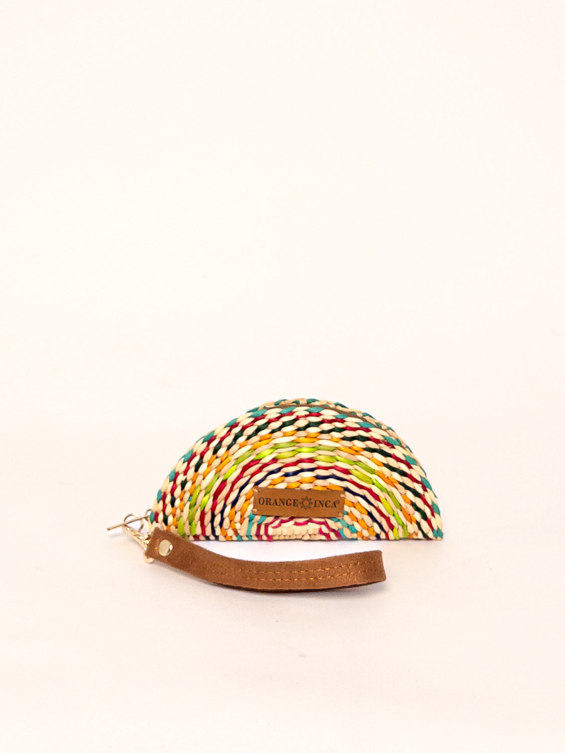 Gran Fiesta Coin Purse – Faux Suede Strap, round coin pouch, multicolor woven exterior, faux suede wrist strap, zip closure.