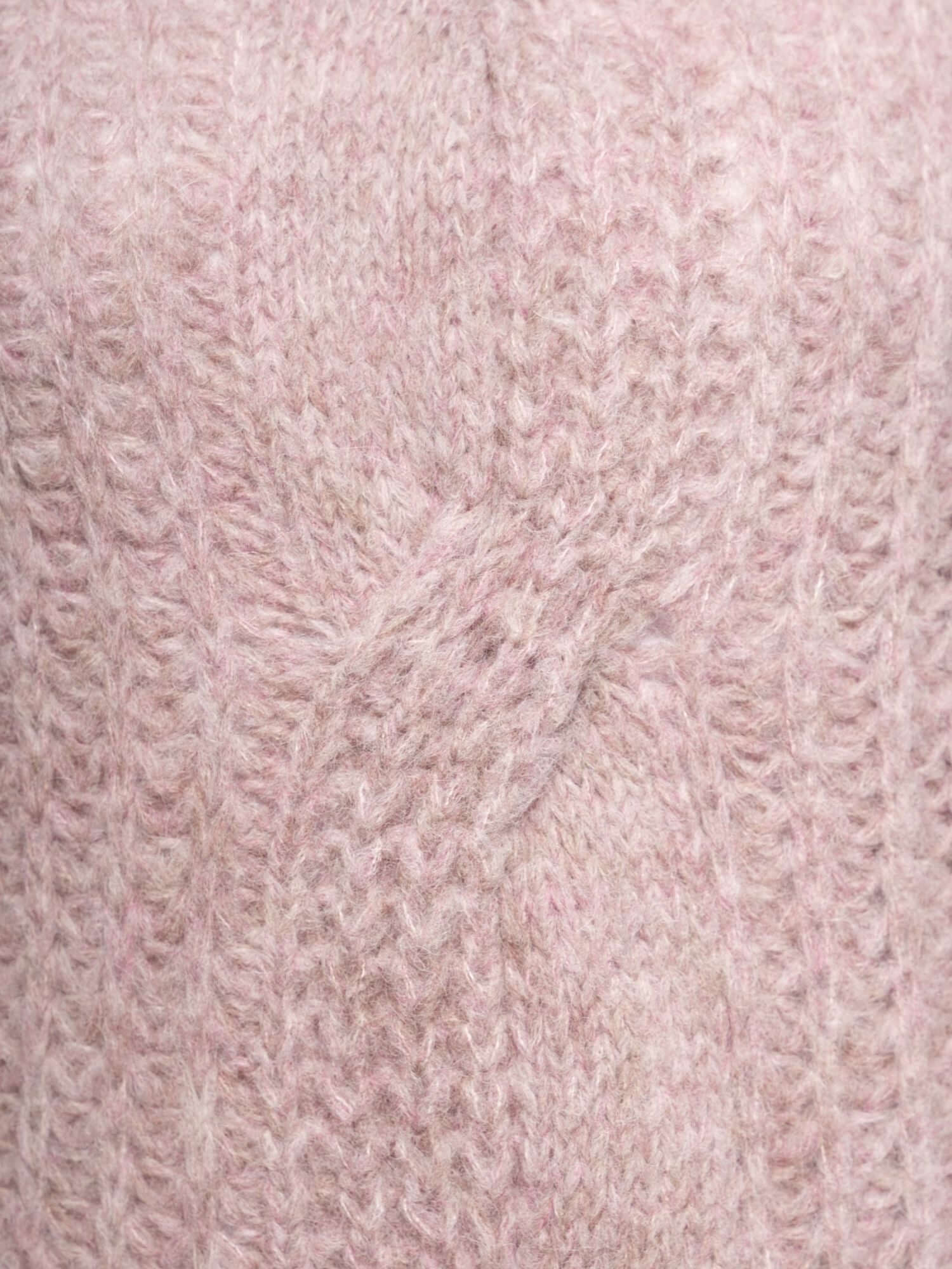 Close-up of pink alpaca turtleneck knit, detailed view of soft wool fibres