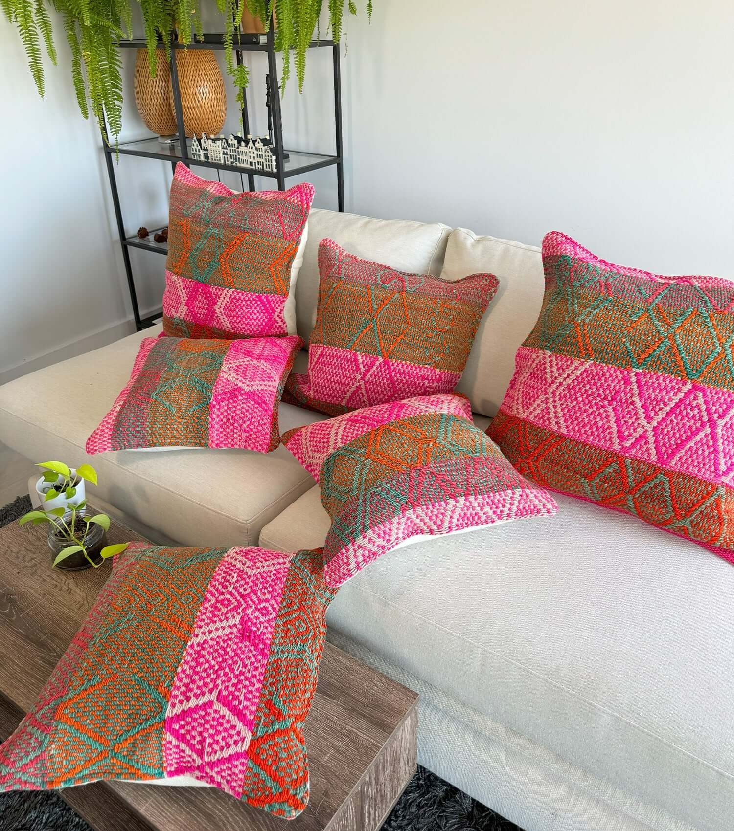 Decorative square pillow No.13 styled on sofa showing ethnic pattern and luxury wool texture