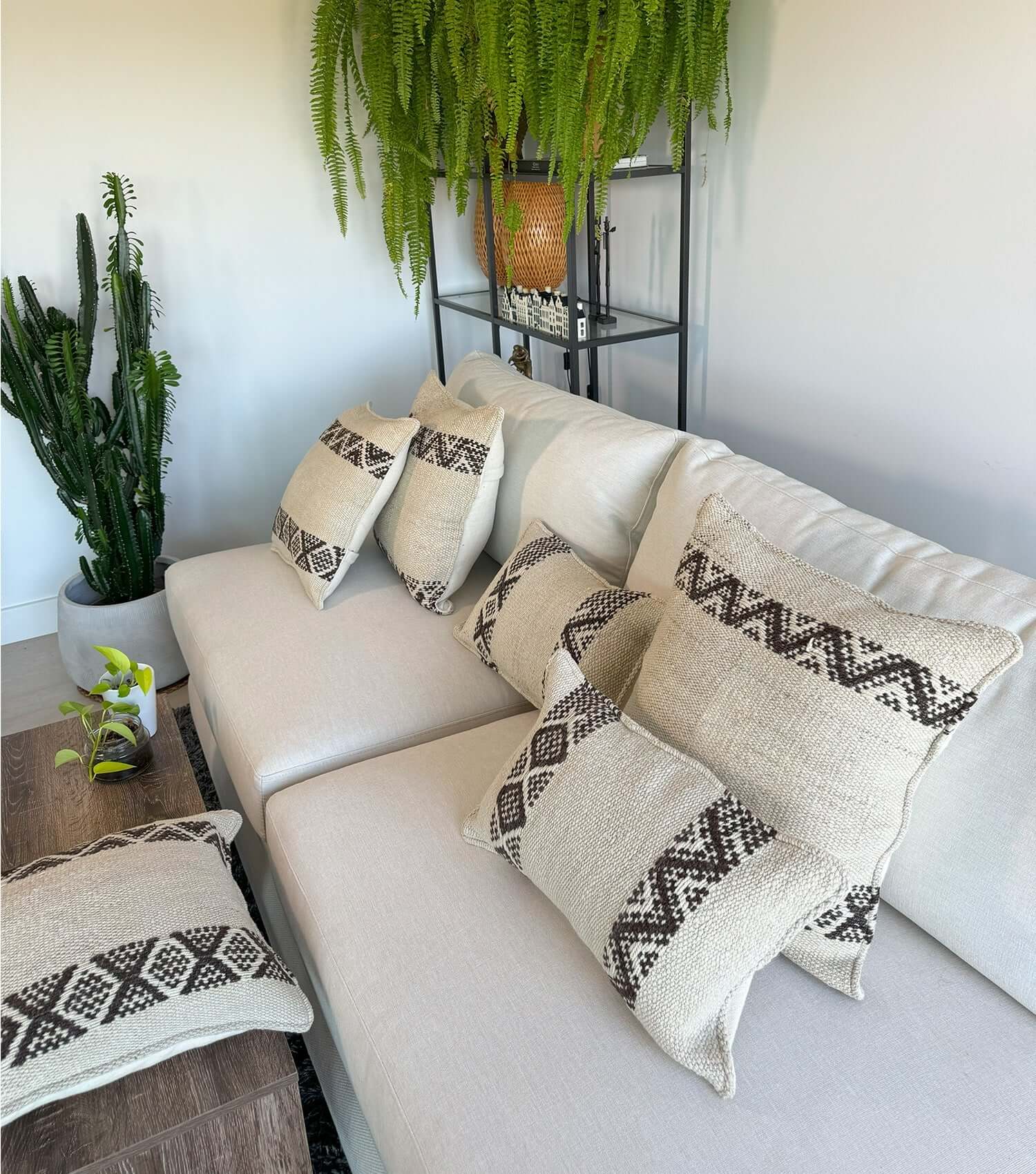 Decorative rectangular pillow 50x30 No.19 styled on sofa showing ethnic pattern and luxury wool texture in earthy neutral colours