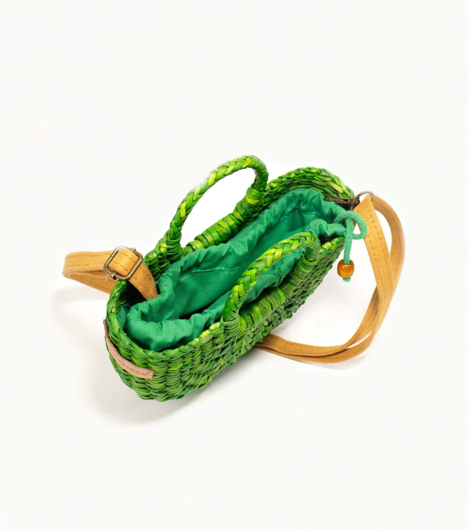 Fiesta Mini emerald green straw crossbody worn across body – everyday bag | Orange Inca