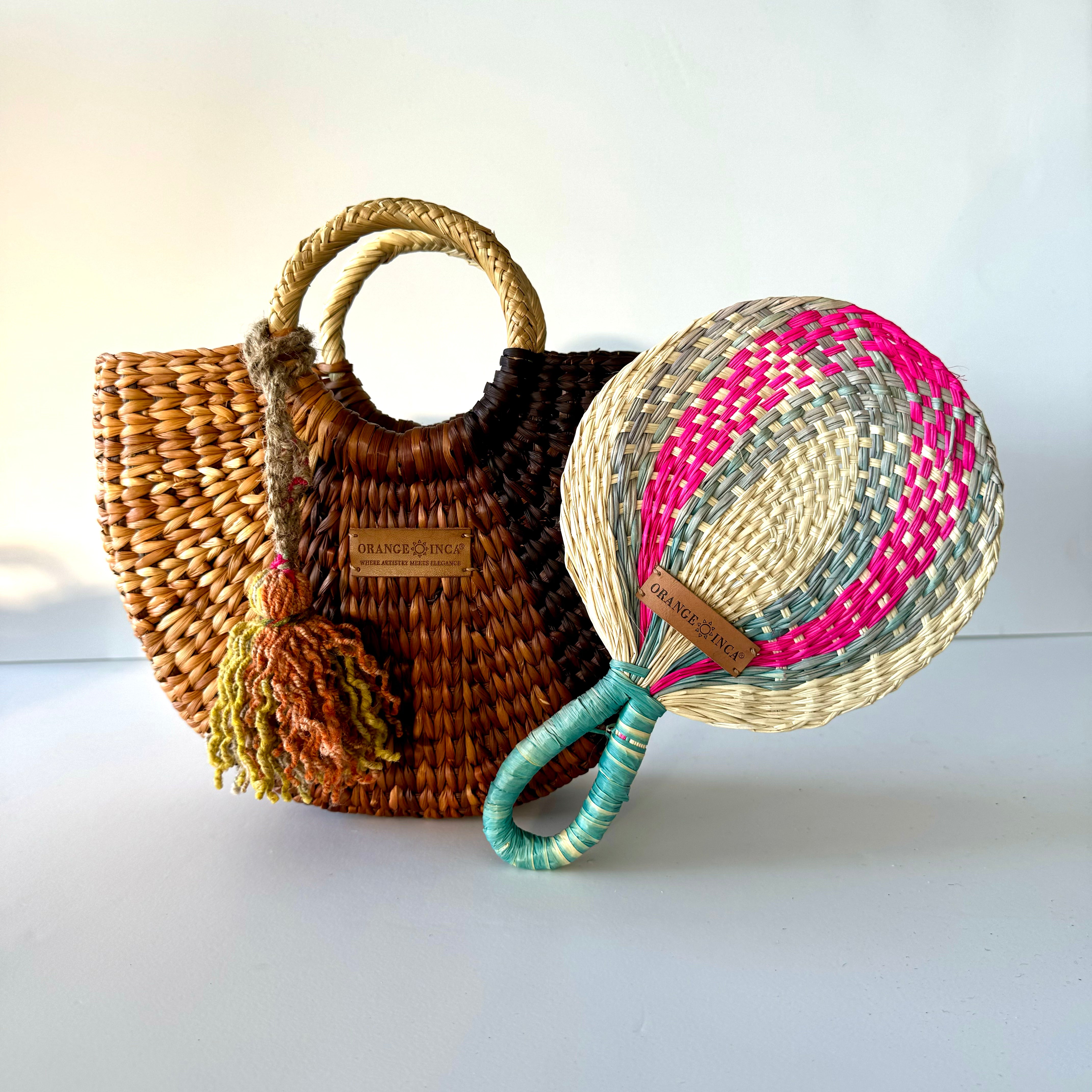 Close-up of steel blue, fuchsia and natural woven reed fan showing junco texture and natural dye detail next to the fiesta crossbody