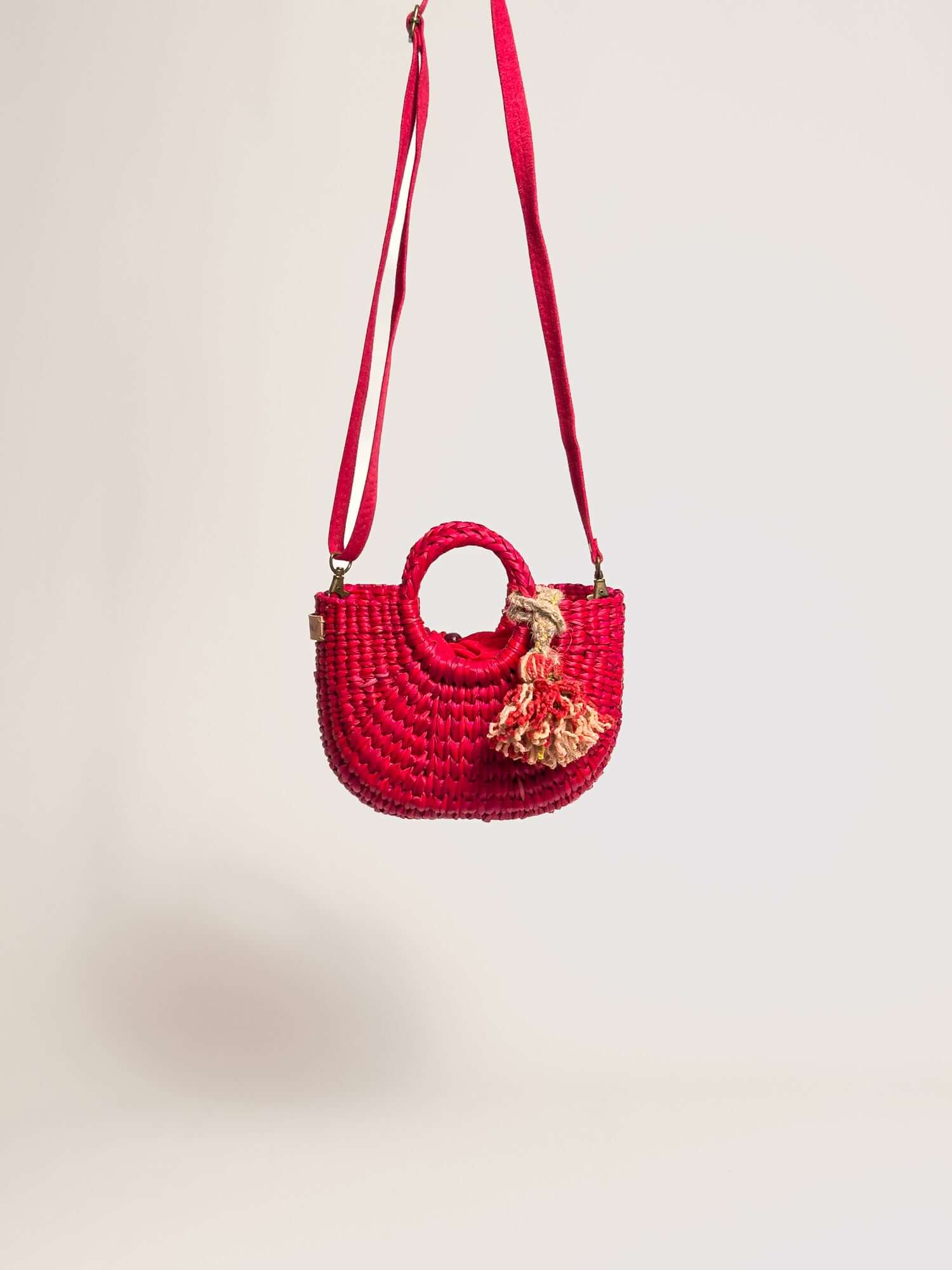 Orange Inca everyday mini bag with artisanal tassel and strap | Red