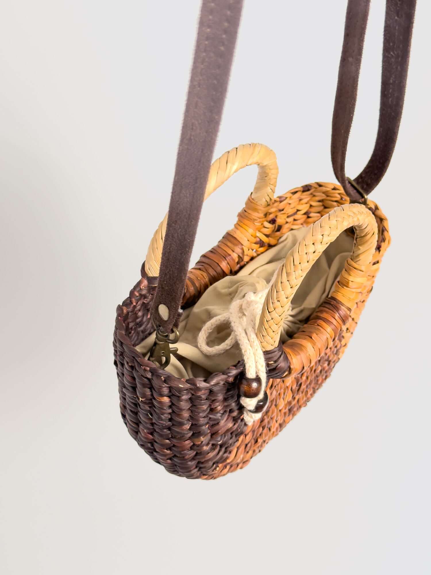 Inside Fiesta Mini reed crossbody bag with drawstring closure |Striped Brown