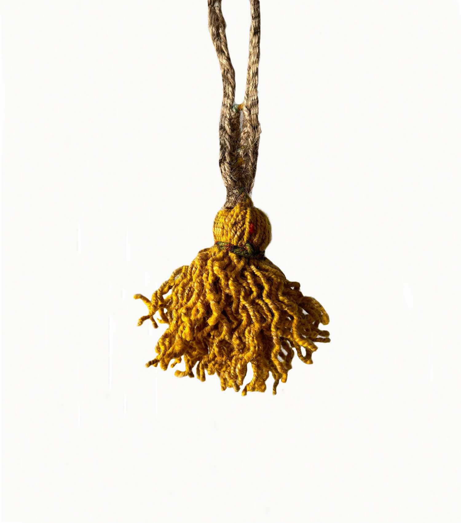 small handmade wool tassel showing size and premium craftsmanship detail