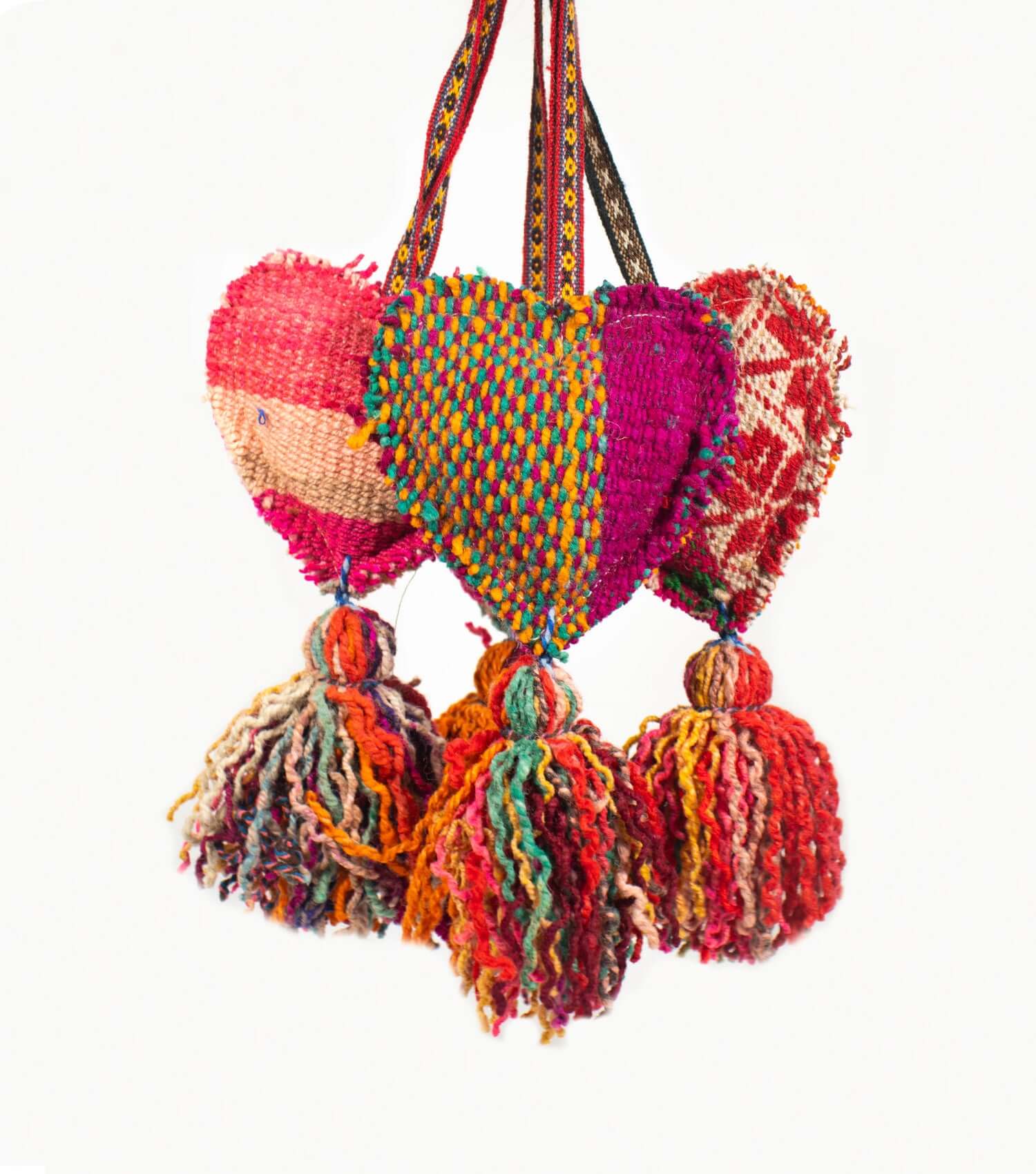Large decorative heart wool tassel showing handcrafted design and vibrant Peruvian textile pattern
