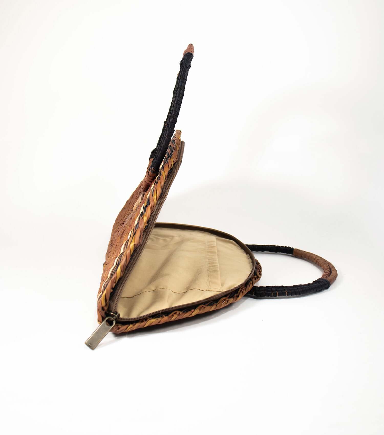 Interior glimpse of Flamenco Swing, with the zipper open to display the sophisticated lining and practical inner pocket.