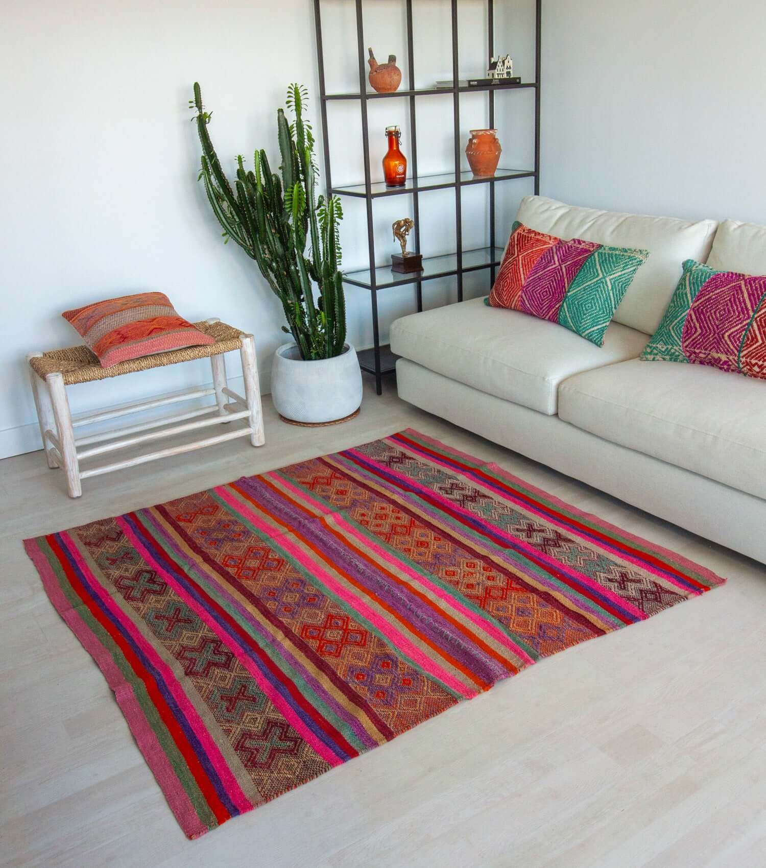 Peruvian frazada No. 8 styled as living room rug — blue, pink, red, purple and lilac, handwoven in Peru | Orange Inca