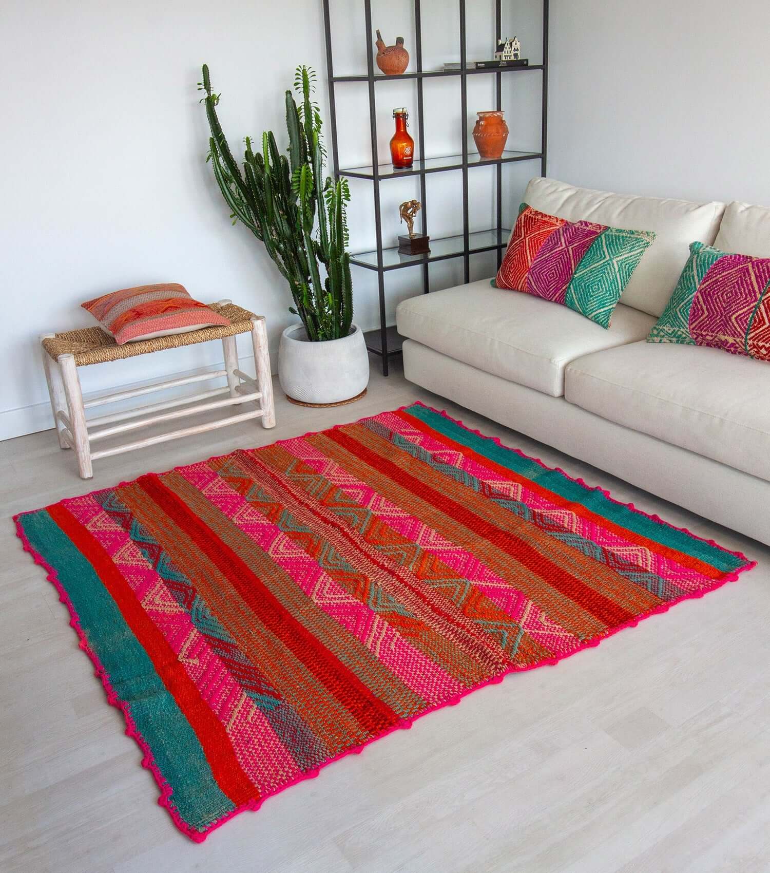 Peruvian frazada No. 15 styled as floor rug — traditional Andean weaving, 163×168cm | Orange Inca