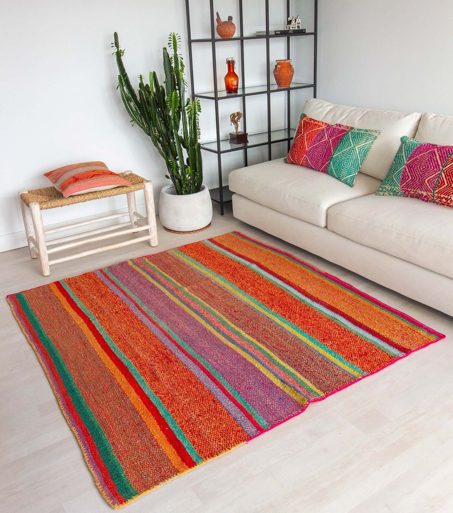 Peruvian frazada No. 7 styled as floor rug — traditional Andean weaving, 176×168cm | Orange Inca