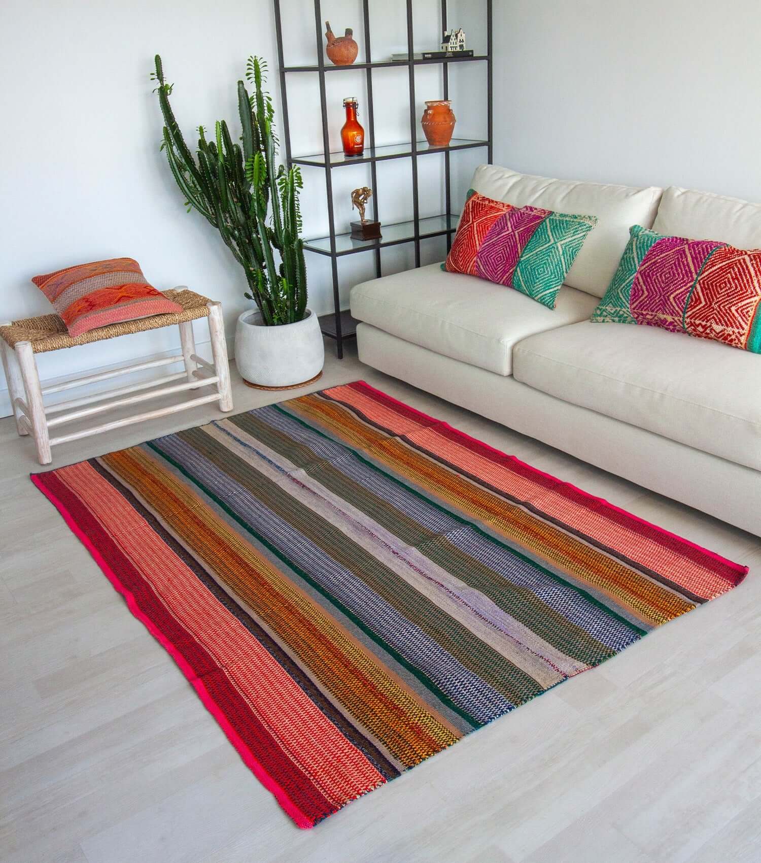 Peruvian frazada No. 14 styled as floor rug — traditional Andean weaving, 196×143cm | Orange Inca