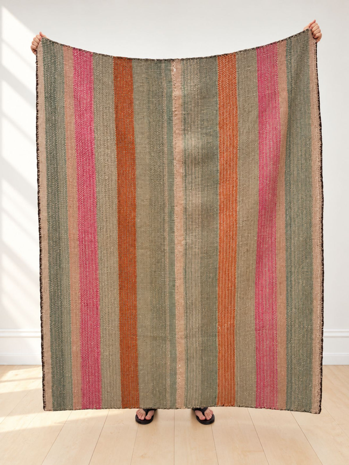 Vintage frazada rug No. 3 held up in full — sage, fuchsia, orange and blush, handwoven Peruvian sheep and alpaca wool, 185 × 150 cm | Orange Inca