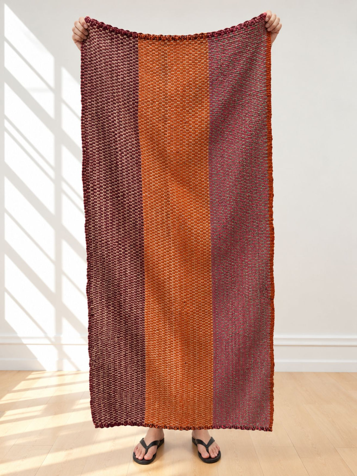 Vintage frazada runner No. 2 held up in full — burgundy, burnt orange and mauve, handwoven Peruvian sheep and alpaca wool, 175 × 85 cm | Orange Inca