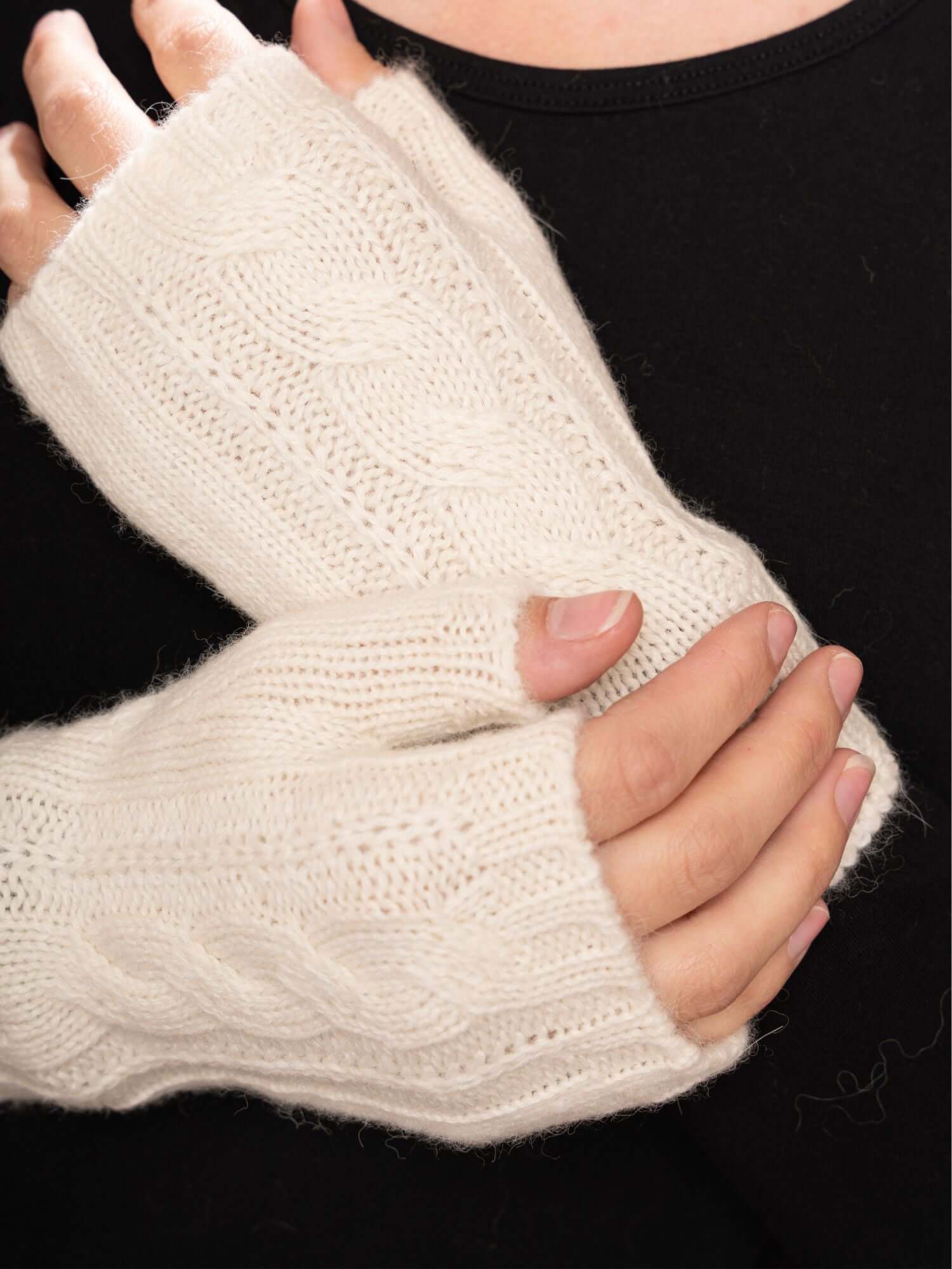 Ivory baby alpaca fingerless gloves styled with black outfit