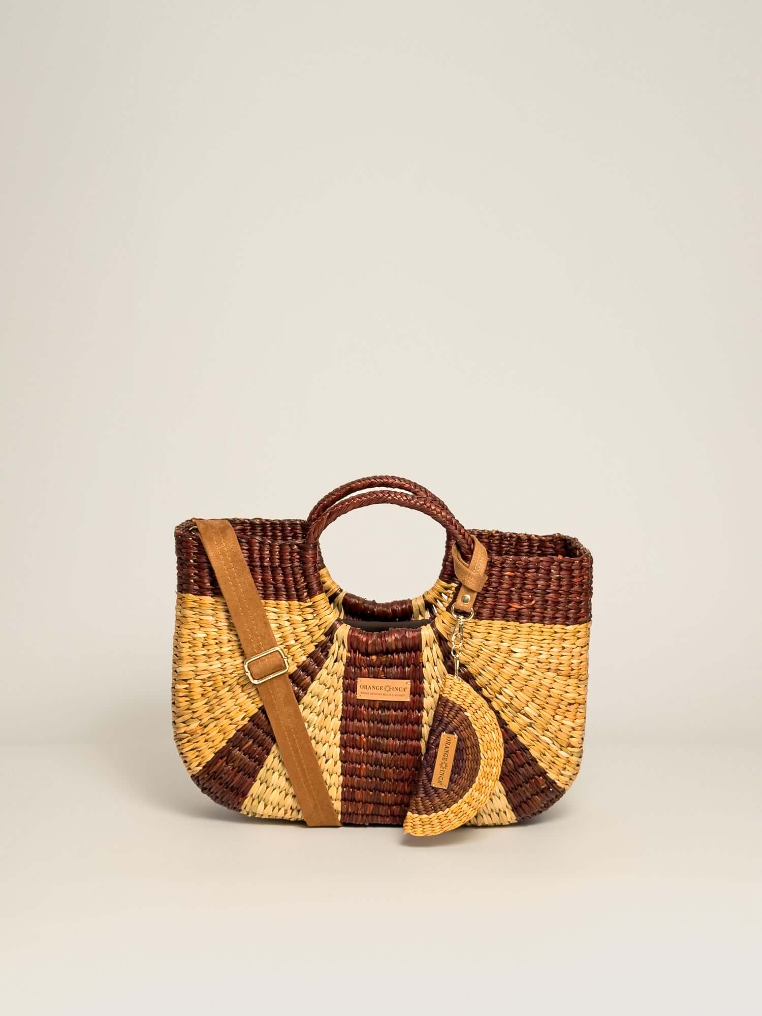Gran Fiesta Crossbody Tote - Natural and Browns, handwoven junco tote bag with structured handles and adjustable strap.