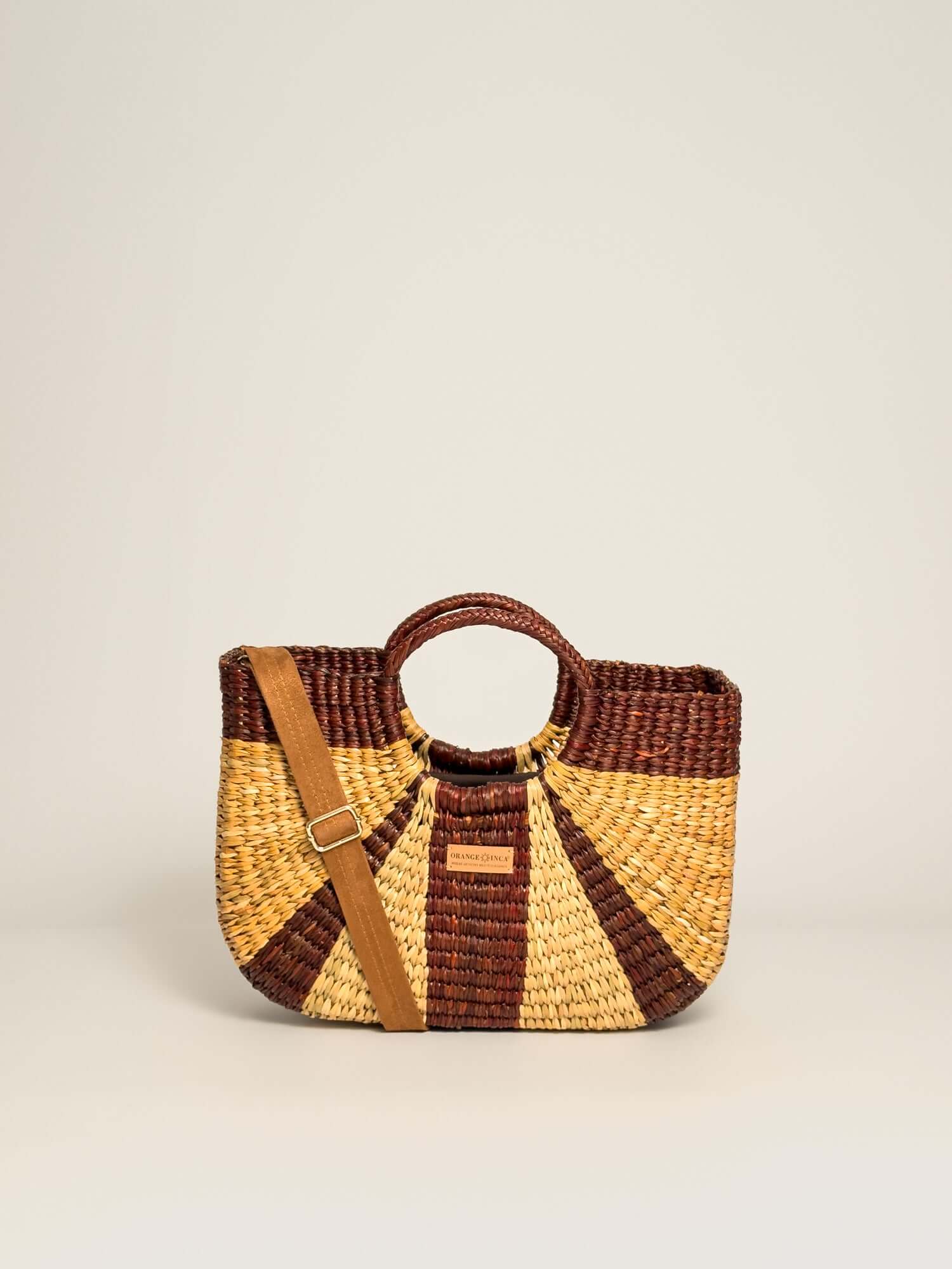 Gran Fiesta Crossbody Tote - Natural and Browns, handwoven junco tote bag, structured handbag, features a handle and adjustable strap.