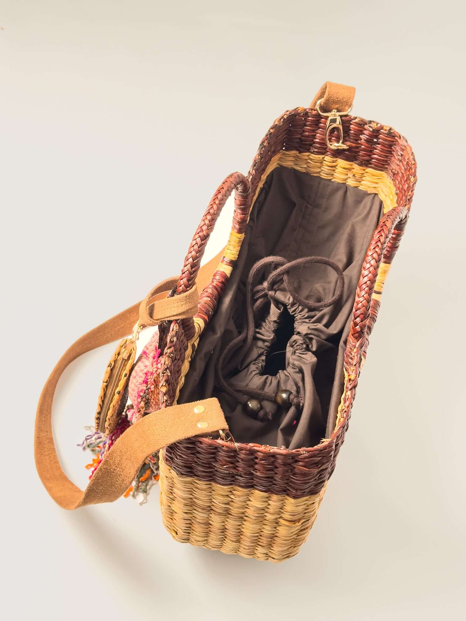 Gran Fiesta Crossbody Tote - Natural and Browns featuring handwoven junco reed, open top, and soft lining.