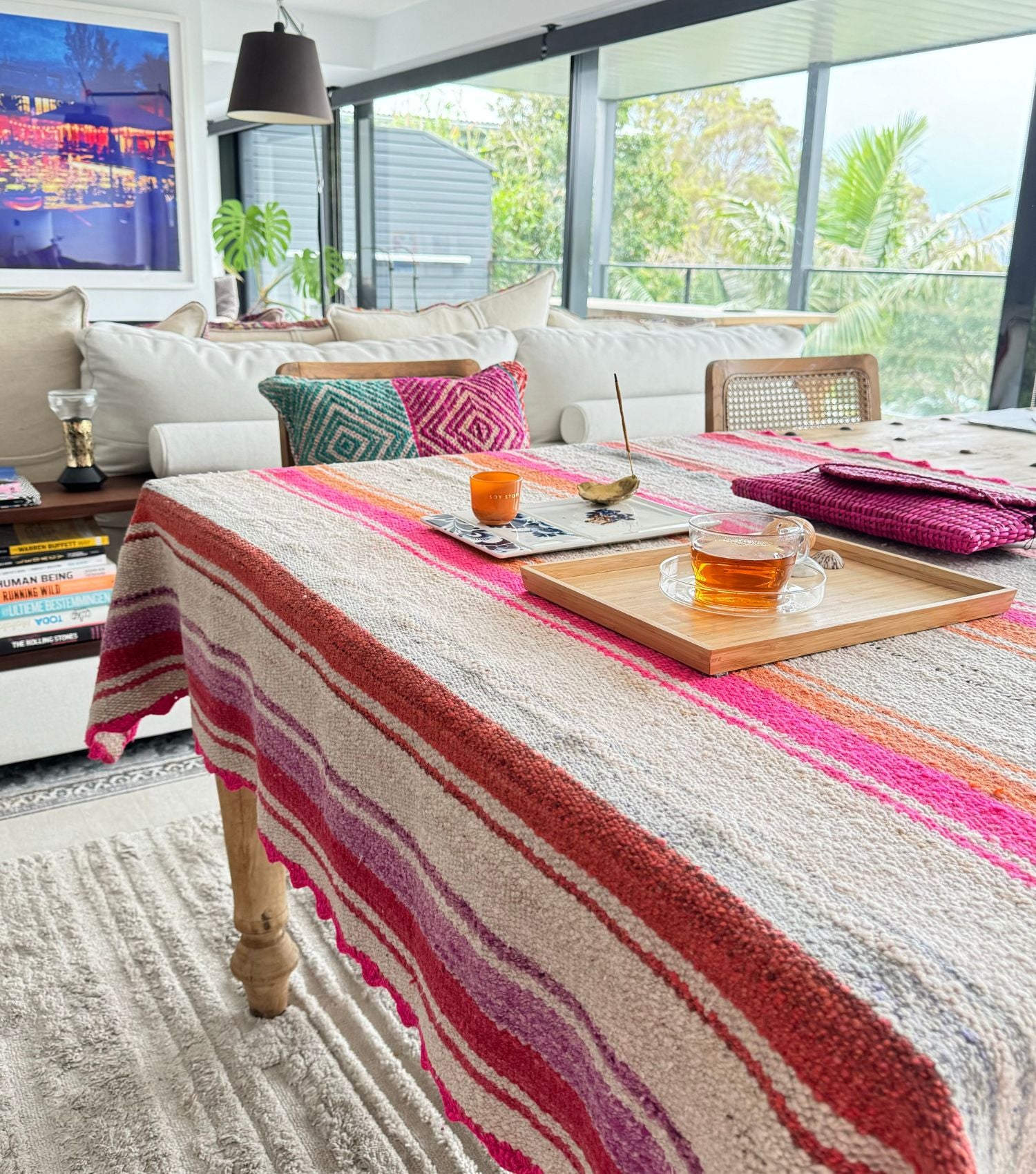 Peruvian wool throw no 2 styled as table cloth showing bohemian pattern in pink orange and earthy washed colours