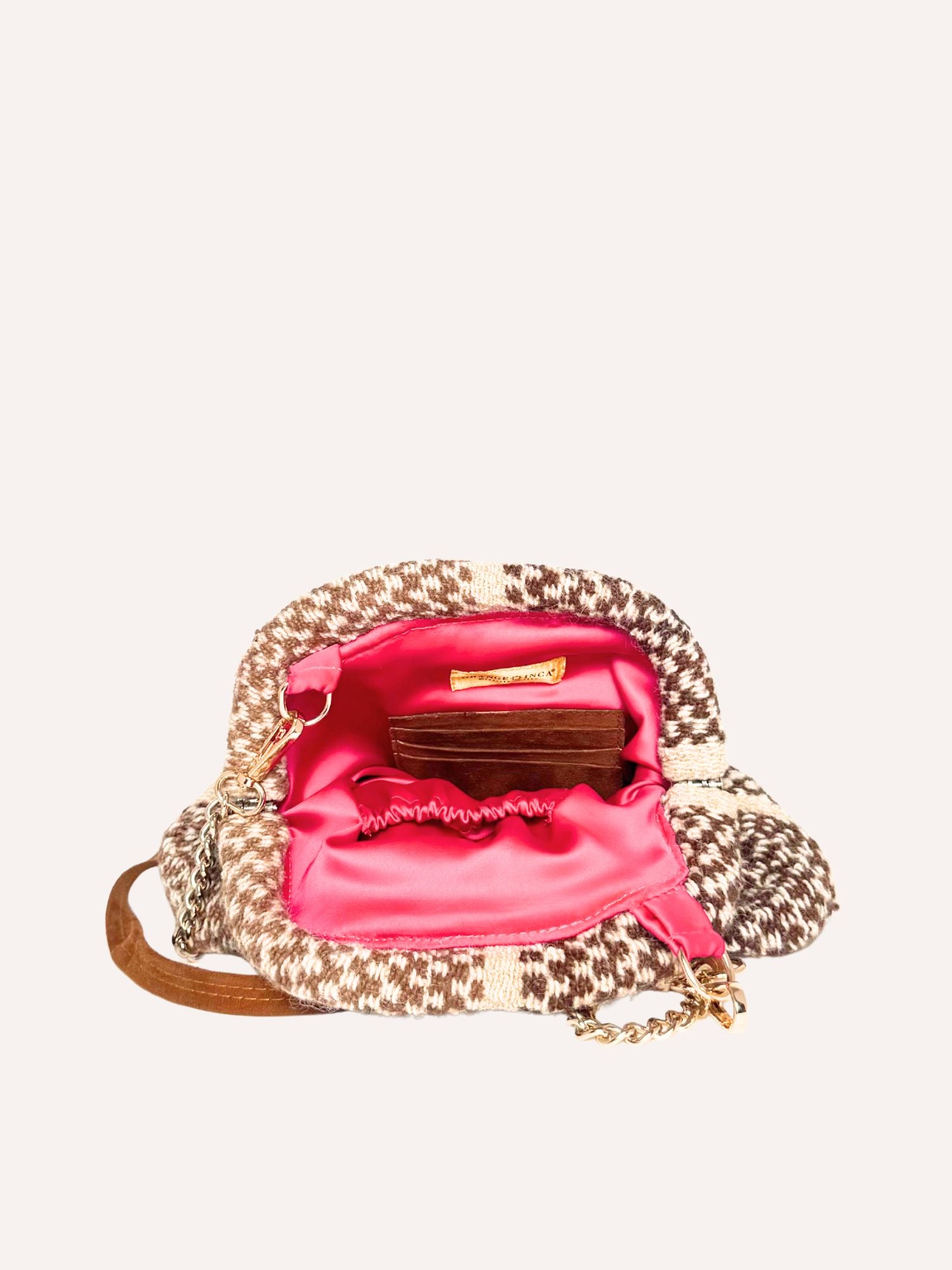 Detail of Luna alpaca kiss lock clutch – handwoven textile pattern | Orange Inca