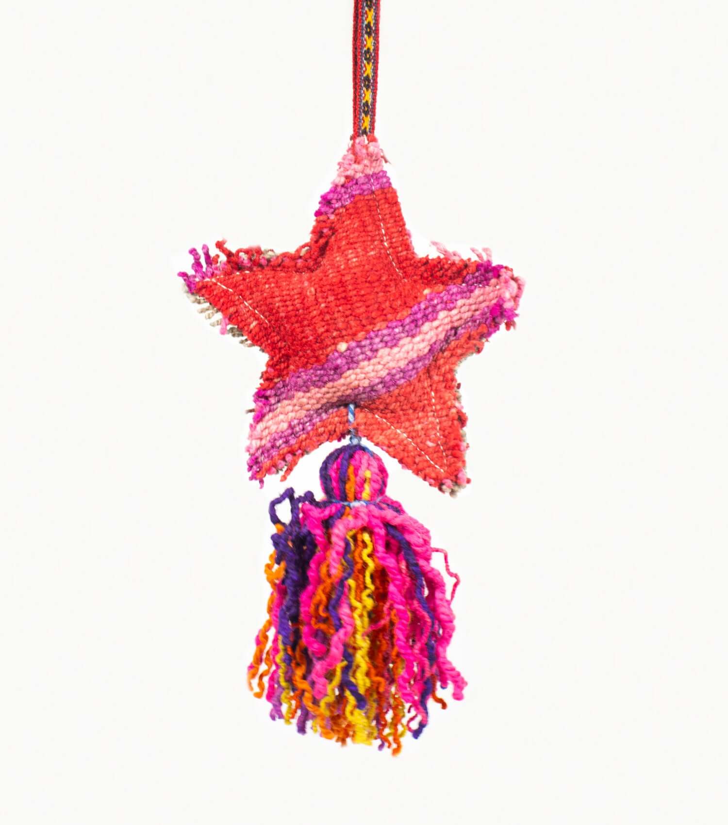 Close-up of handmade wool star tassel showing premium frazada textile and natural dyes