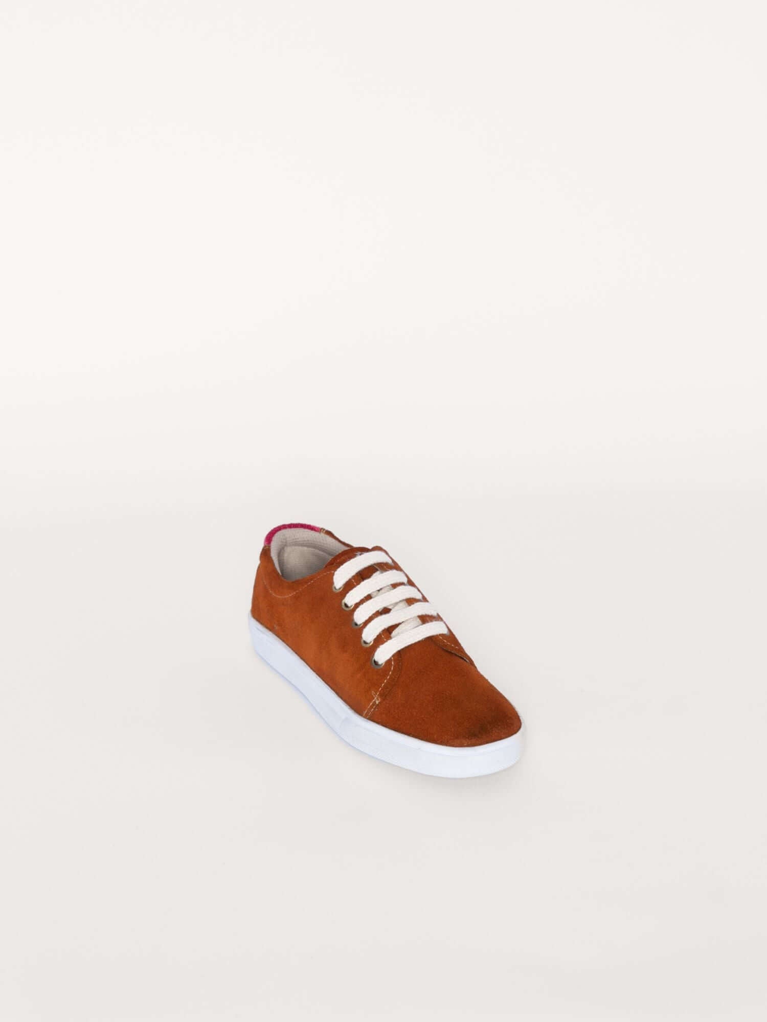 Sustainable leather sneakers with Andean wool accents, front diagonal.
