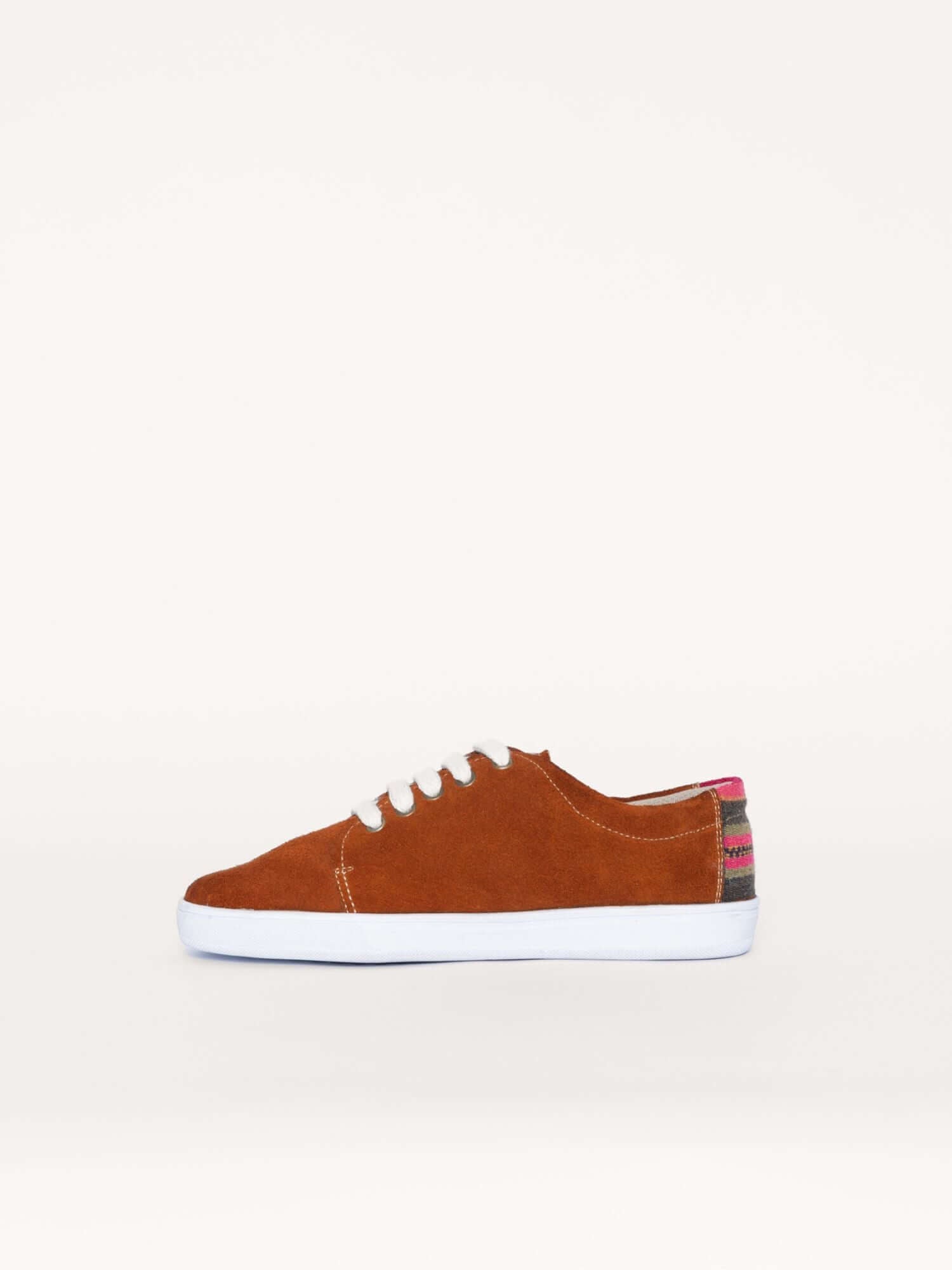 Handcrafted leather and wool sneakers in camel brown, left side view.