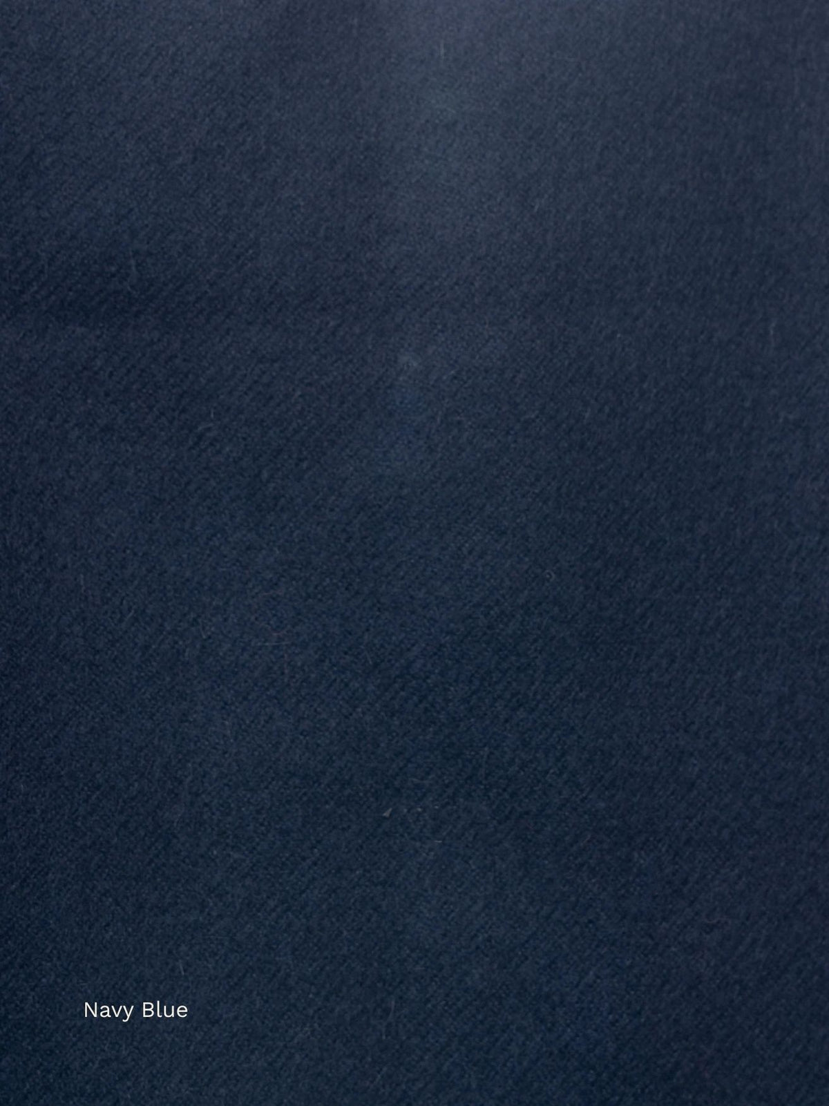 Navy blue naturally dyed baby alpaca scarf, close-up of the deep midnight blue soft fabric