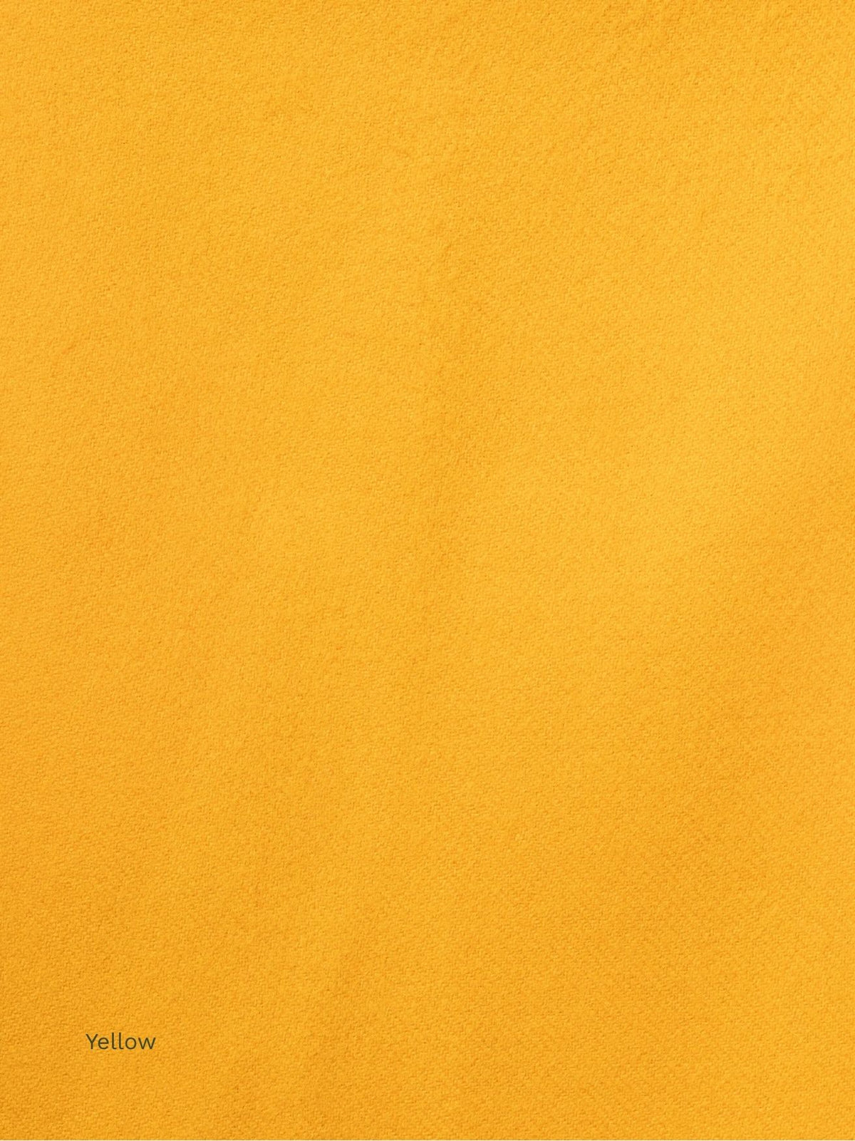 Yellow naturally dyed baby alpaca scarf, close-up of the golden yellow soft fabric