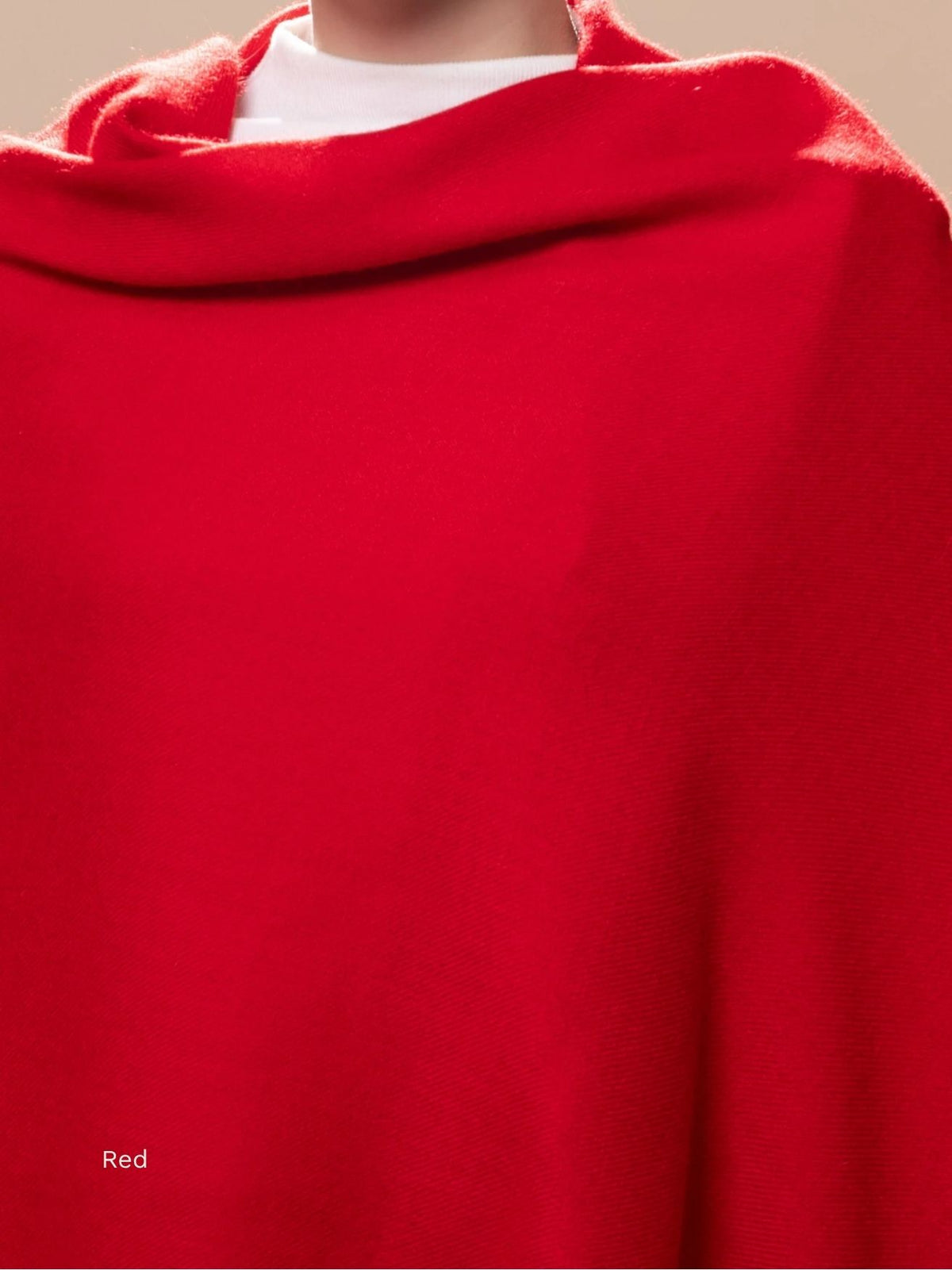 Red naturally dyed baby alpaca shawl wrapped around the shoulders, rich colour and soft drape