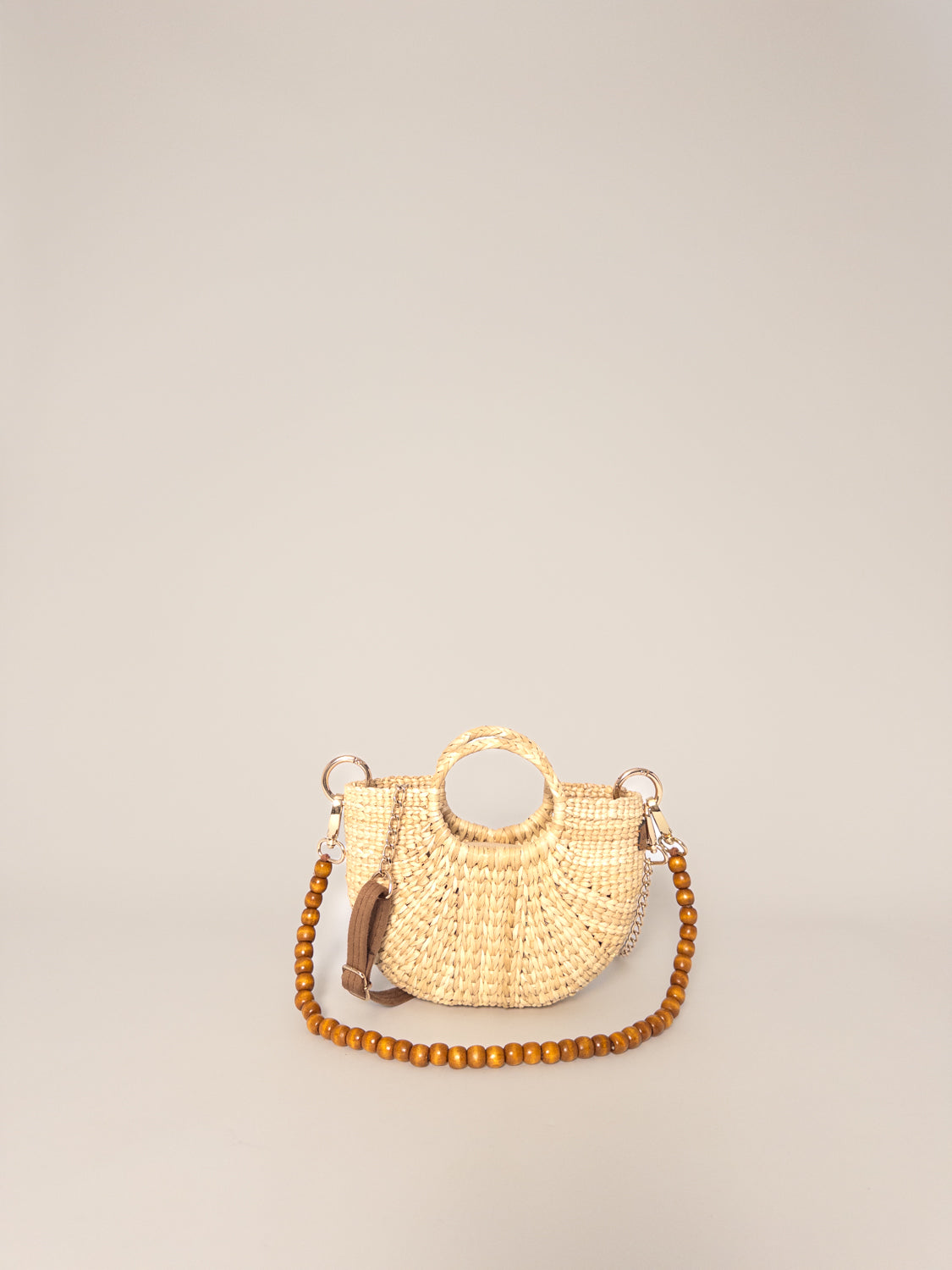 The Fiesta Mini Deluxe - Natural, handwoven junco crossbody bag, natural fibre handbag, wooden bead strap, round handle.