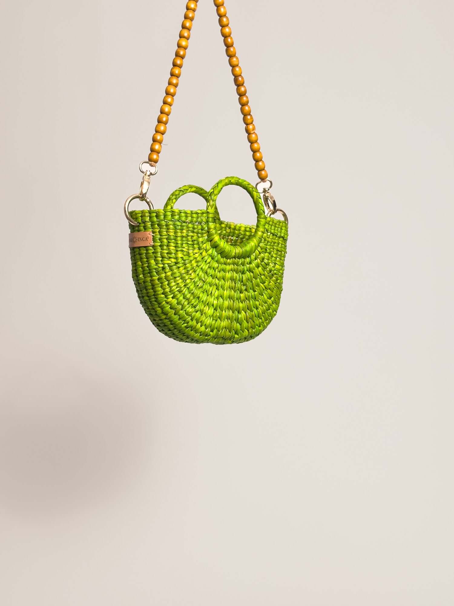The Fiesta Mini Deluxe - Lime Green, handwoven junco crossbody bag, natural fibre handbag with wooden beads strap.