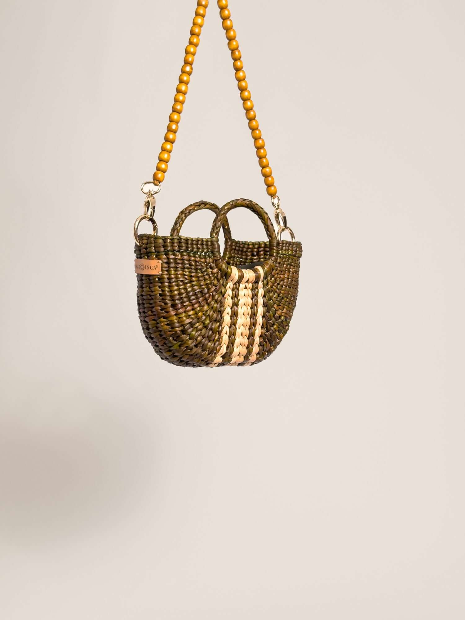 The Fiesta Mini Deluxe - Olive Green with Natural Band handwoven junco crossbody bag with wooden beads strap.