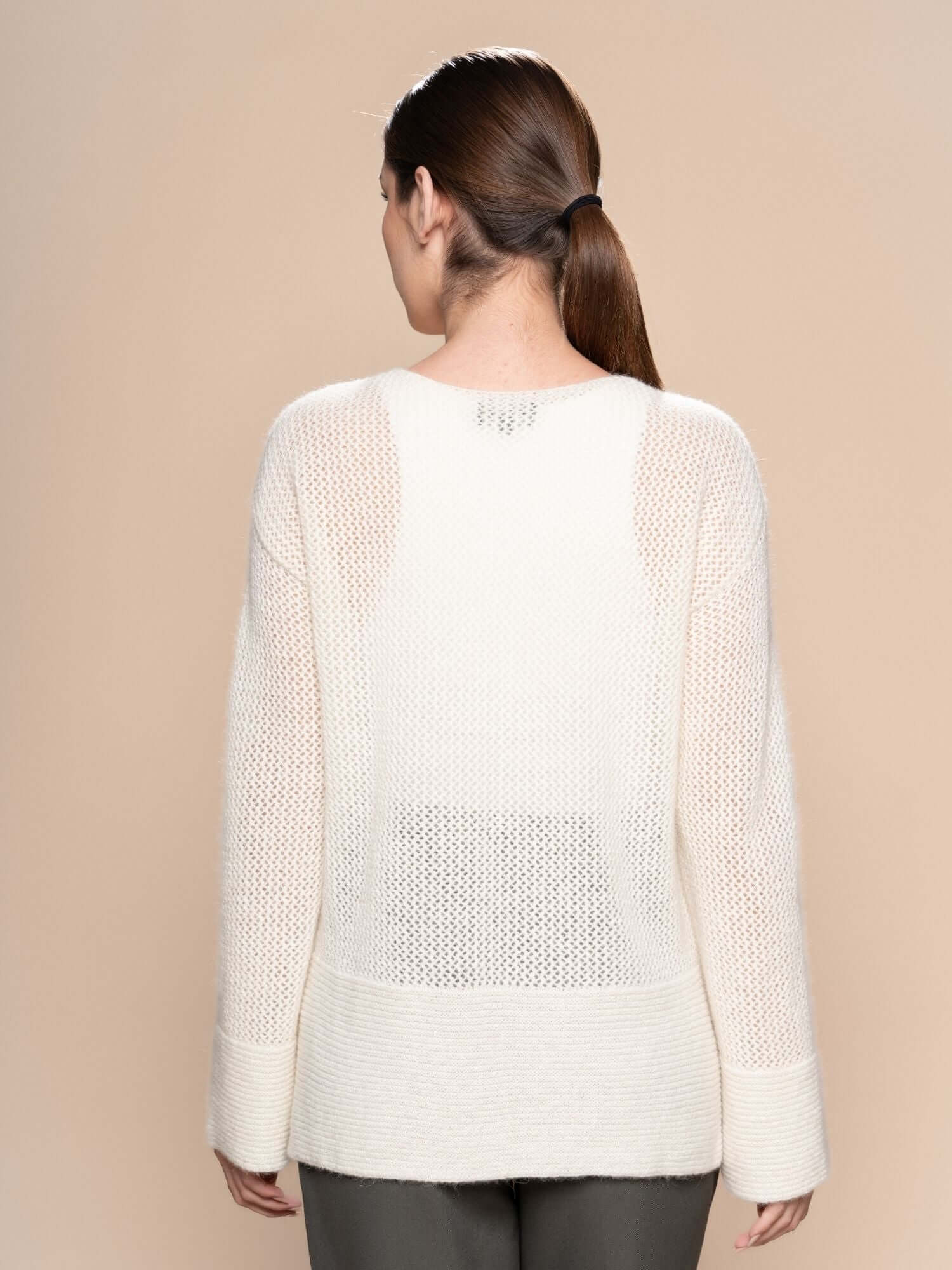Front-on view of ivory alpaca wool jumper with sheer textured knit finish