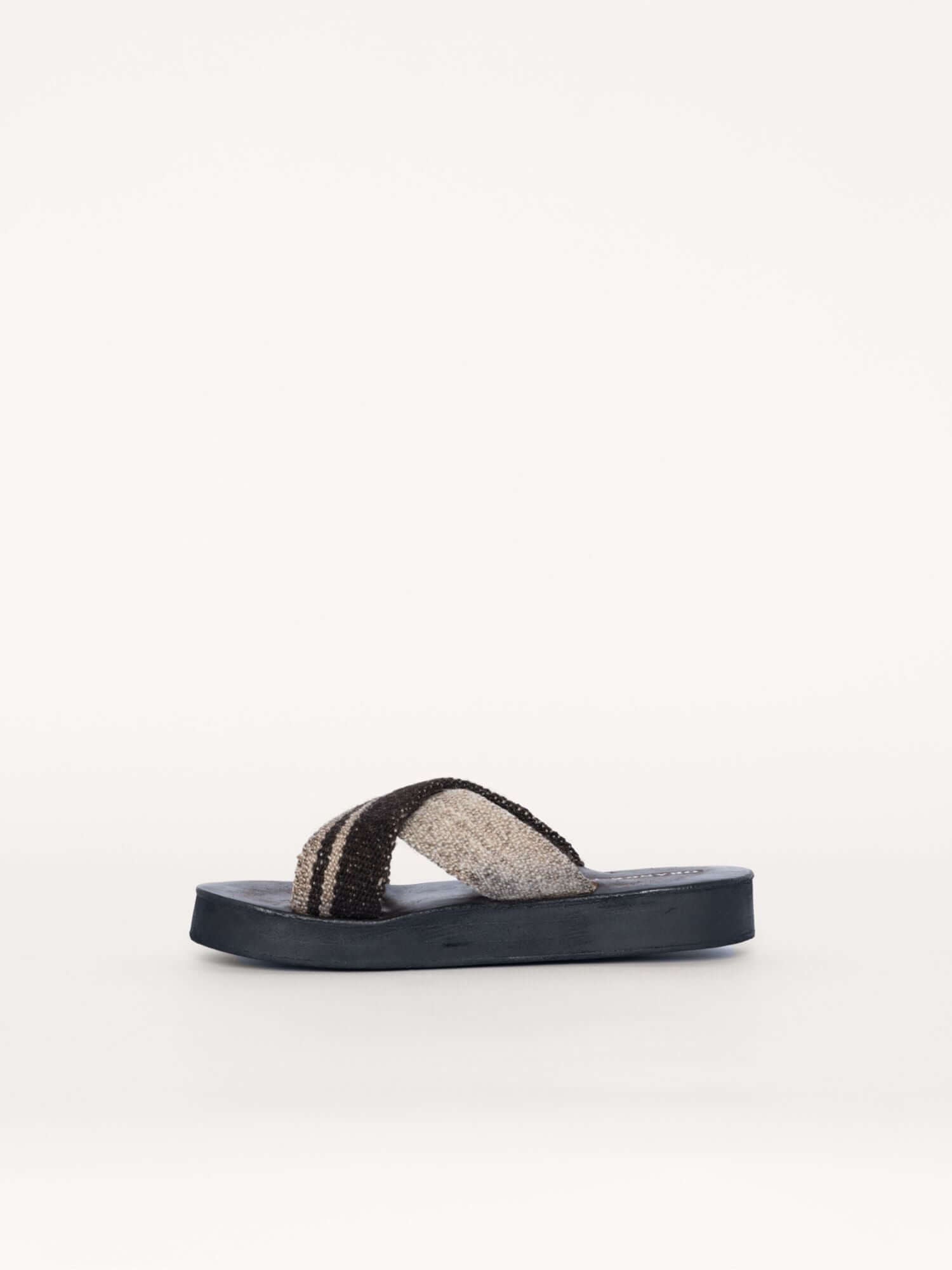 Brown and ivory handmade wool and leather x sandals, left side view.