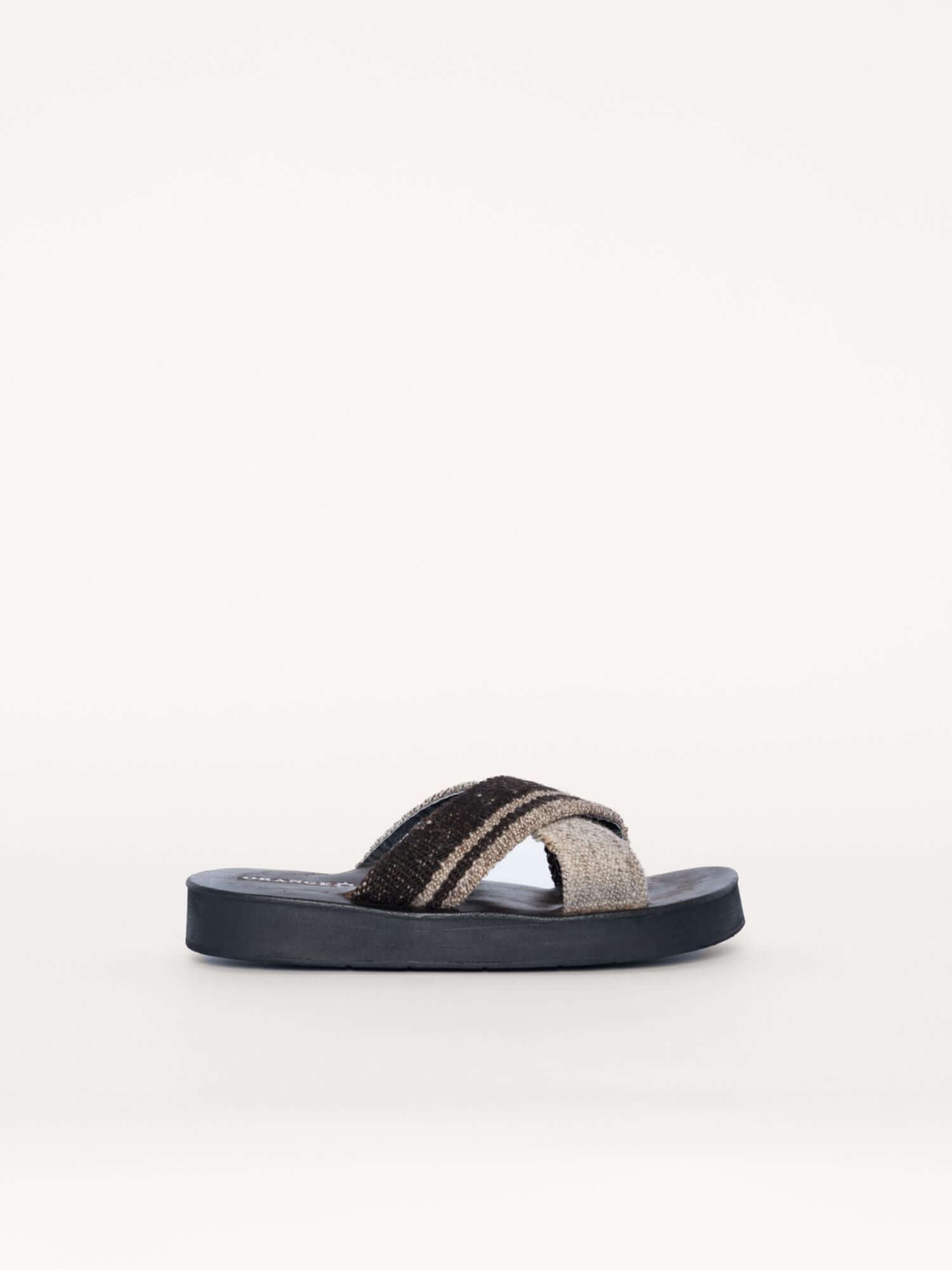 Brown and ivory leather x sandals for women and men with handwoven wool straps, side view.