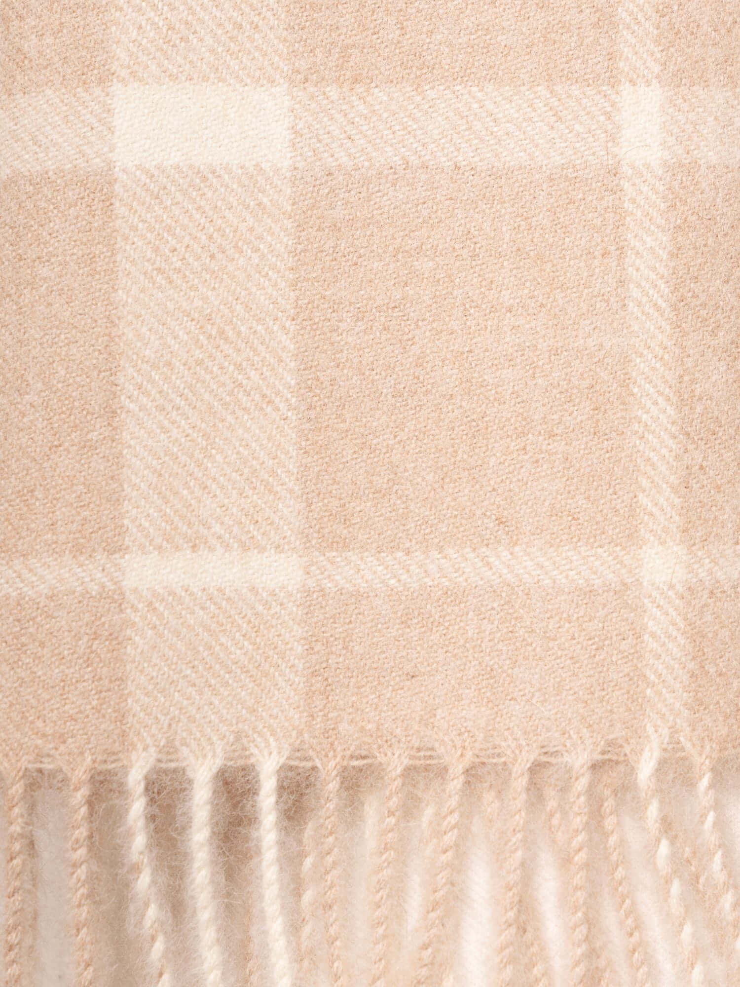 Close up of baby alpaca scarf in plaid beige and white for men and women