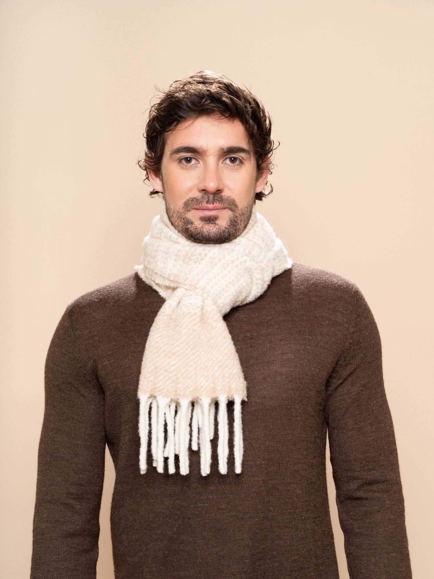 Model wearing beige and ivory striped wool scarf, handwoven with baby alpaca blend