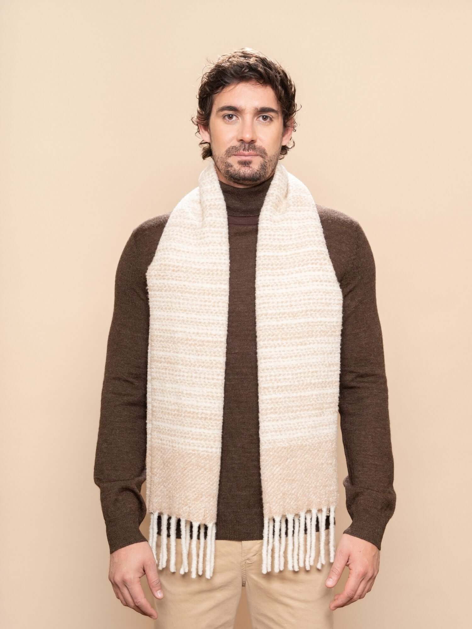 Model wearing neutral stripe alpaca wool scarf over dark top, warm and breathable